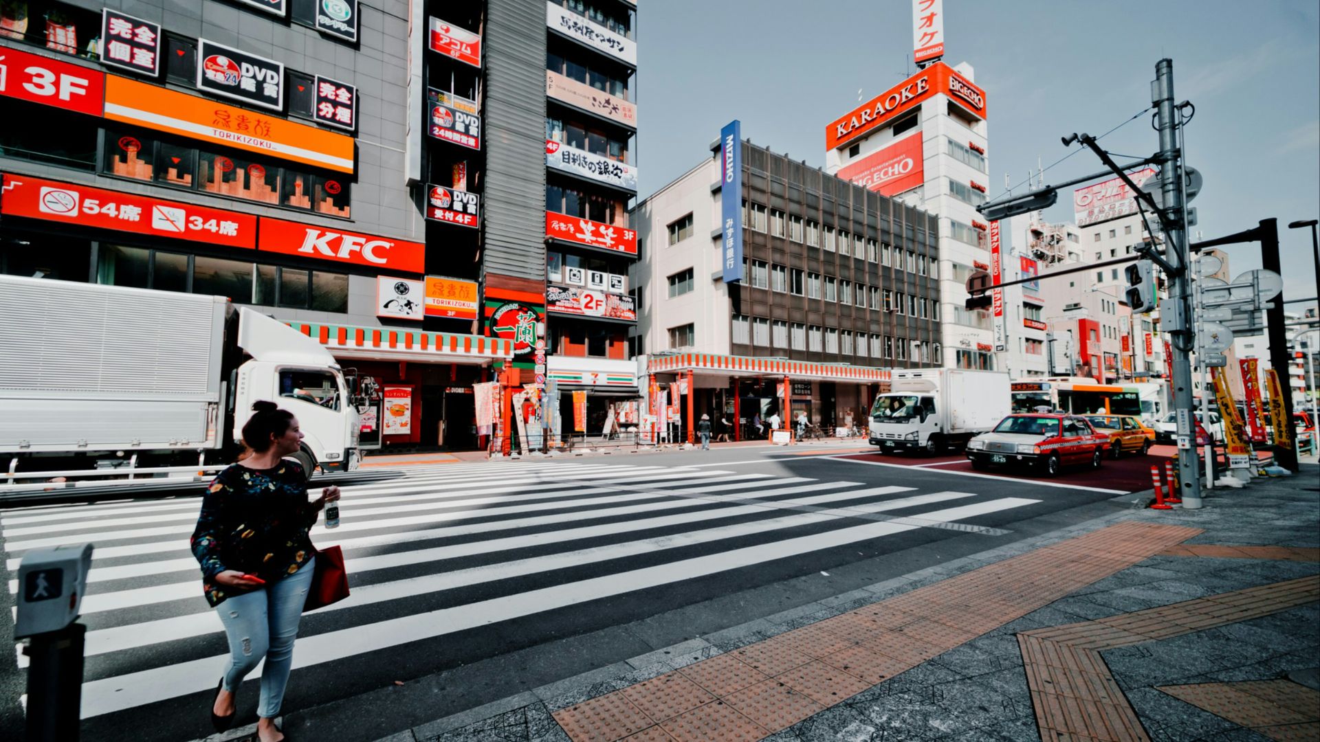 woman walking on pedestrian lane