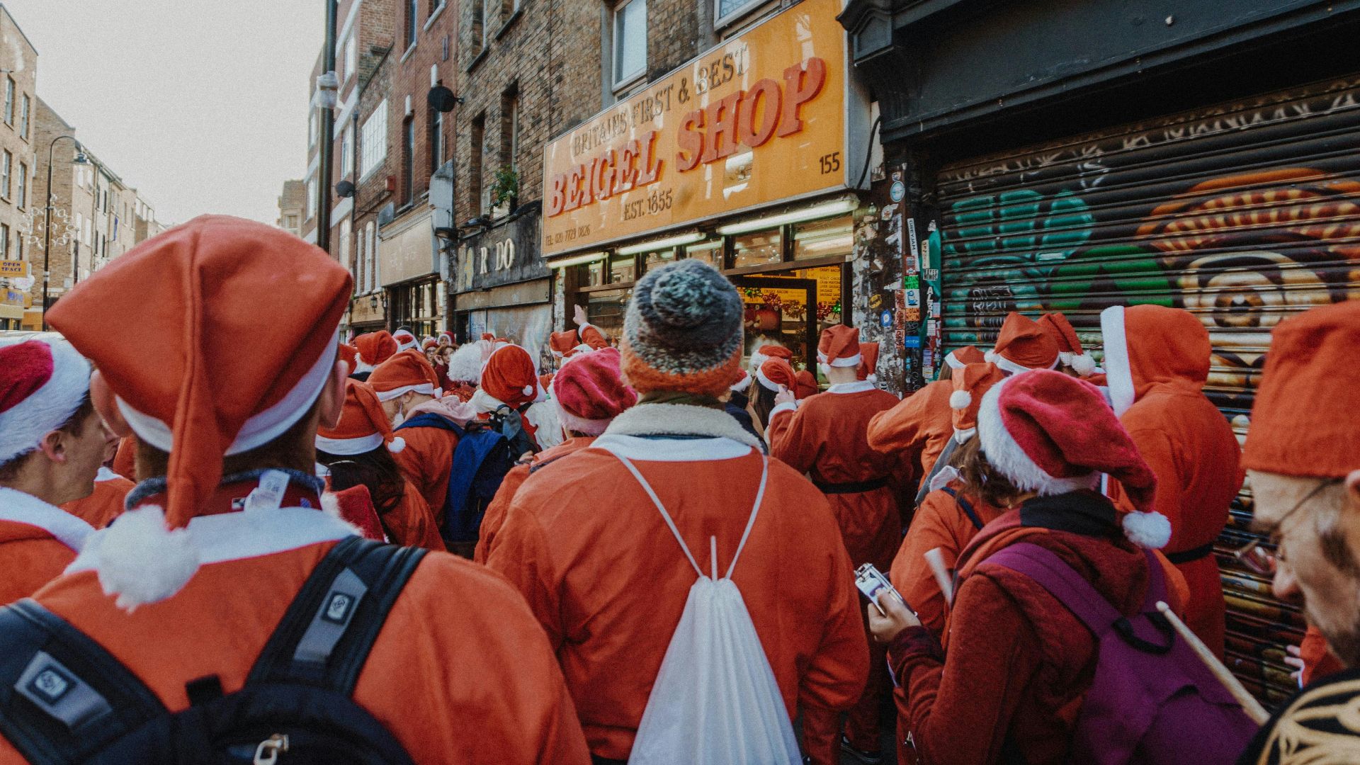 people wearing Santa costume on road
