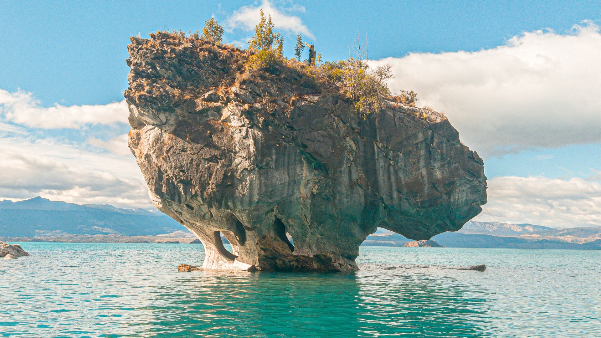 a large rock in the water