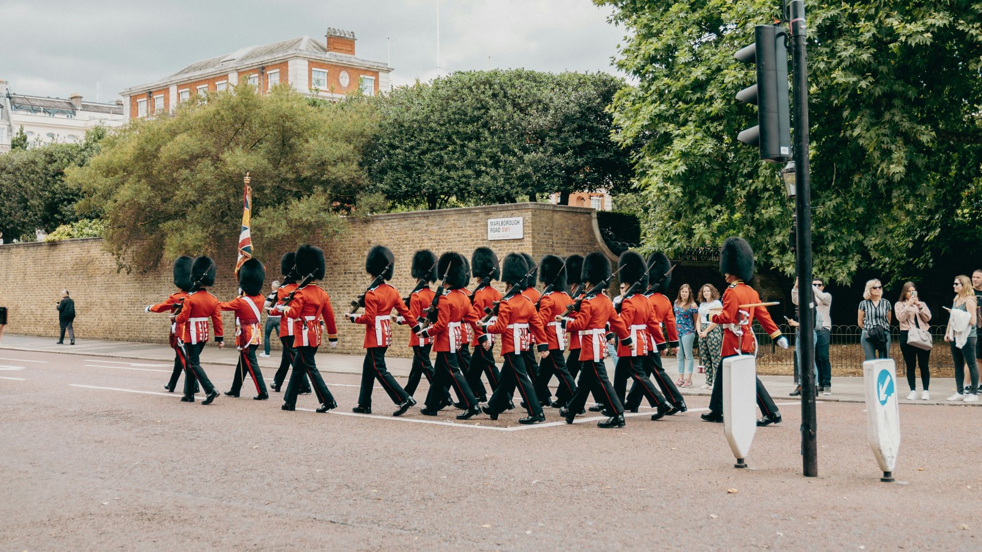 a group of people in red uniforms marching in a parade