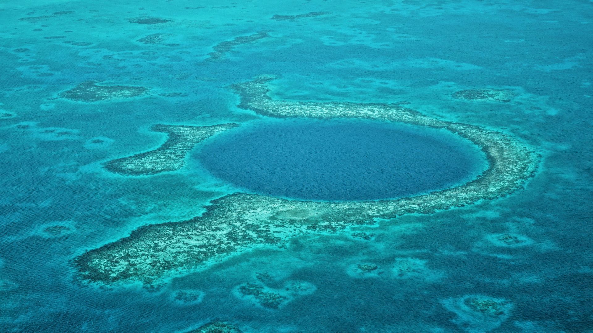 A large blue hole in the middle of the ocean