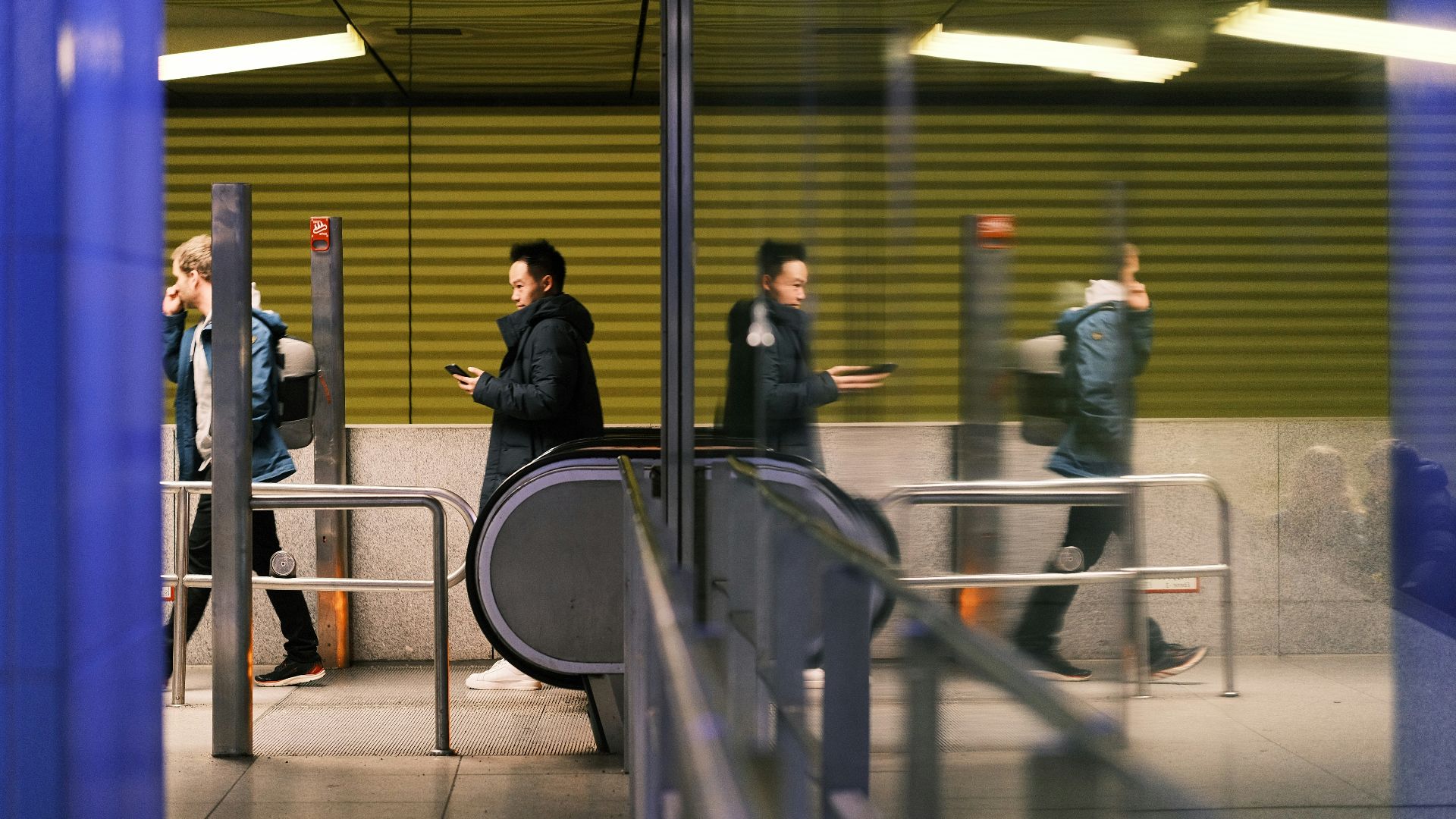 a group of people standing around a train station