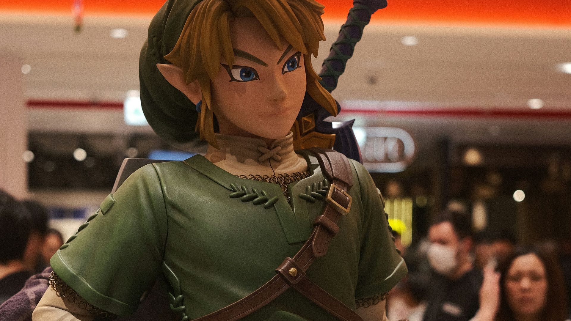 a statue of a woman in a green outfit