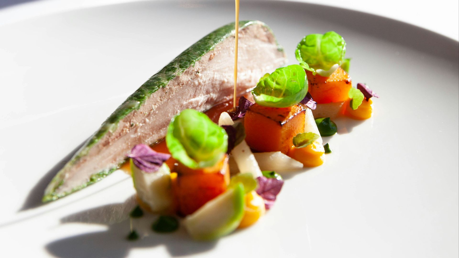 person holding stainless steel spoon