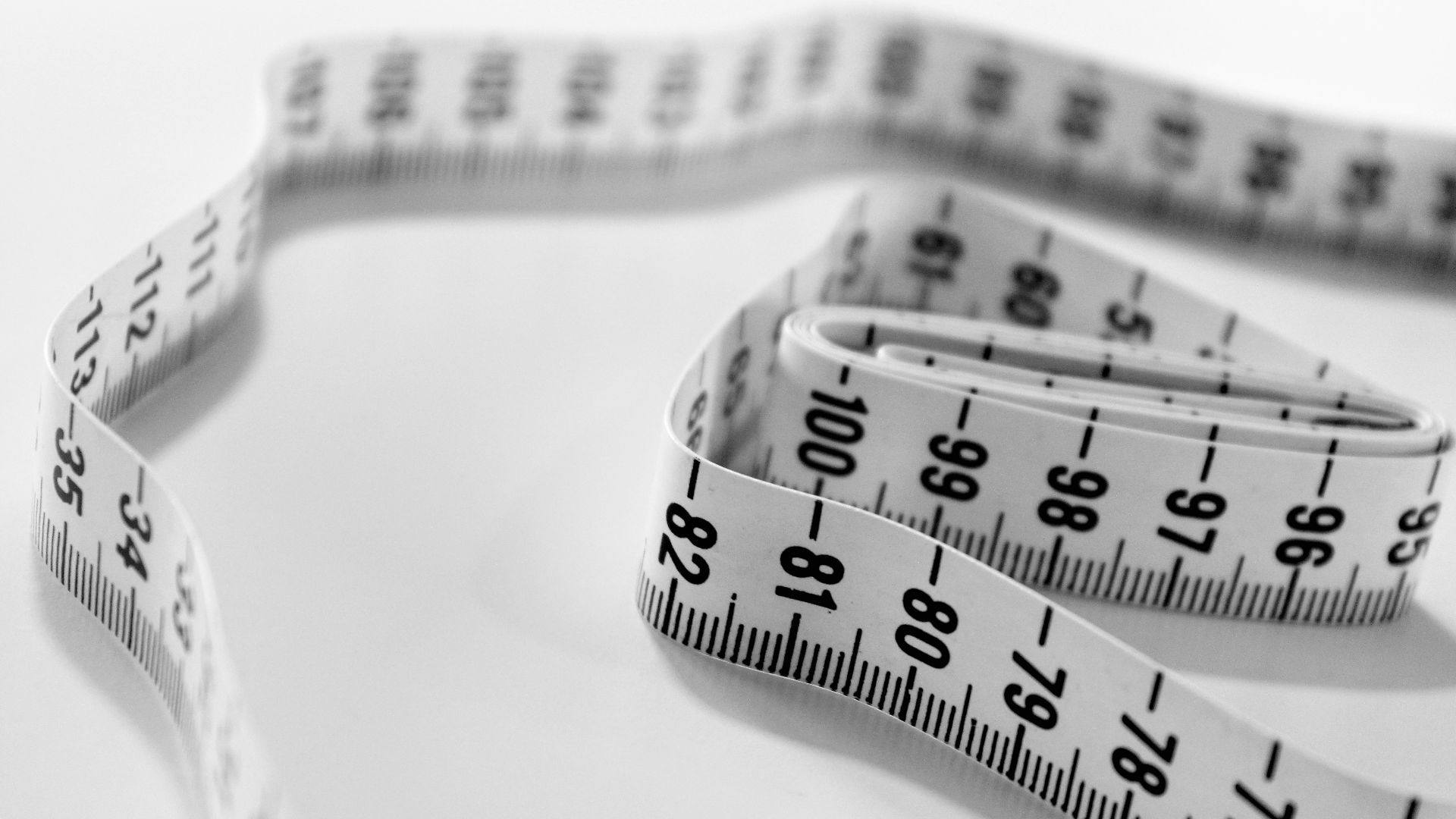 selective focus photography of tape measure