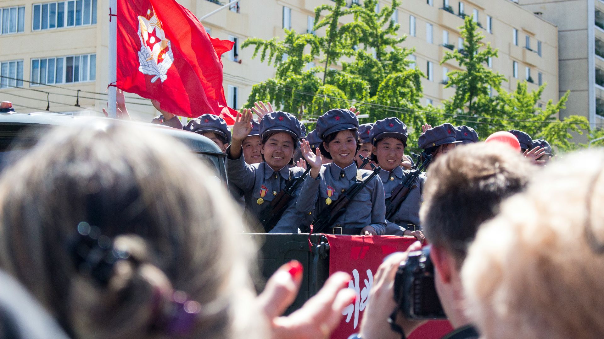people gathering in front of building during daytime