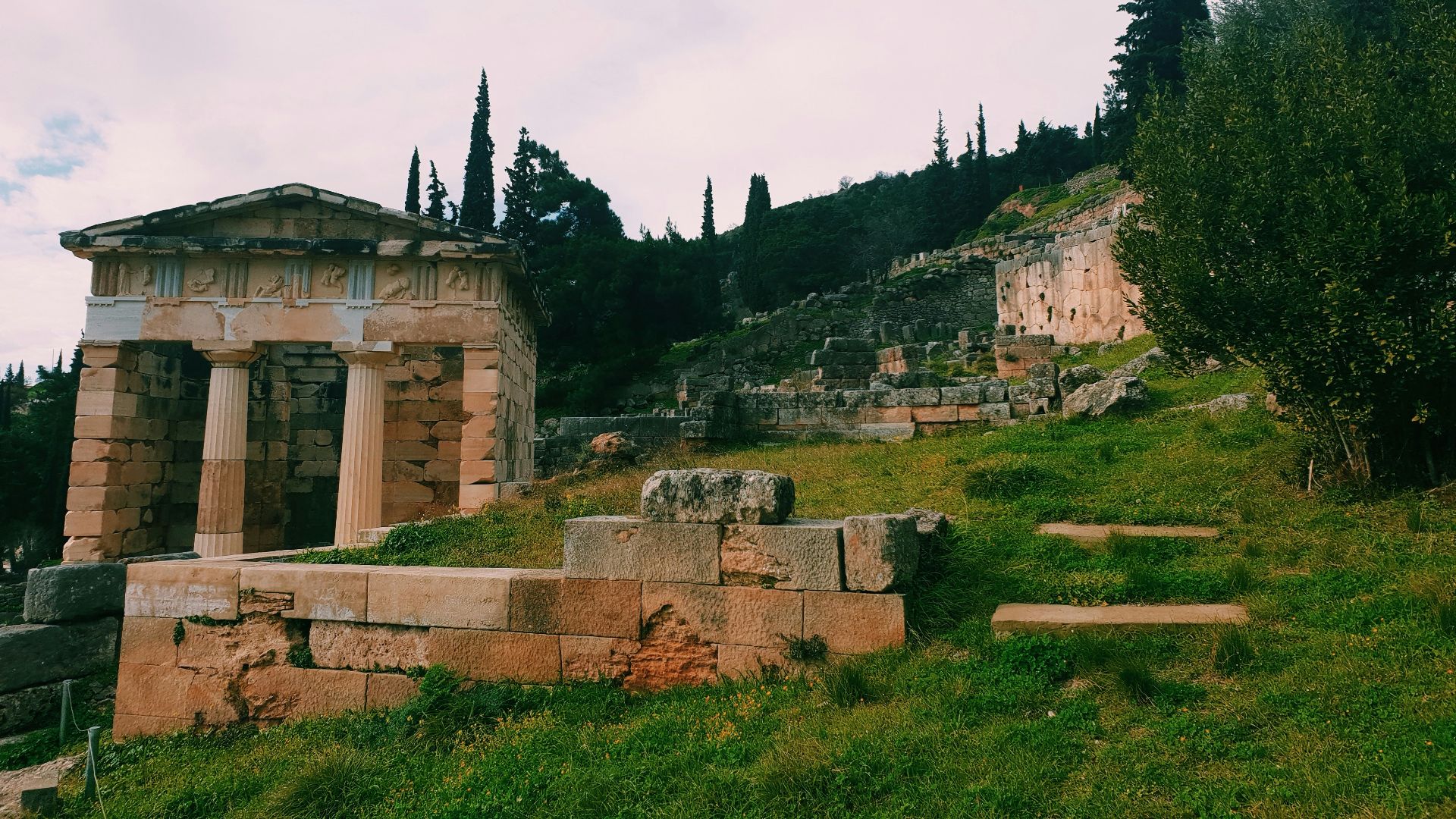 a stone building on a hill