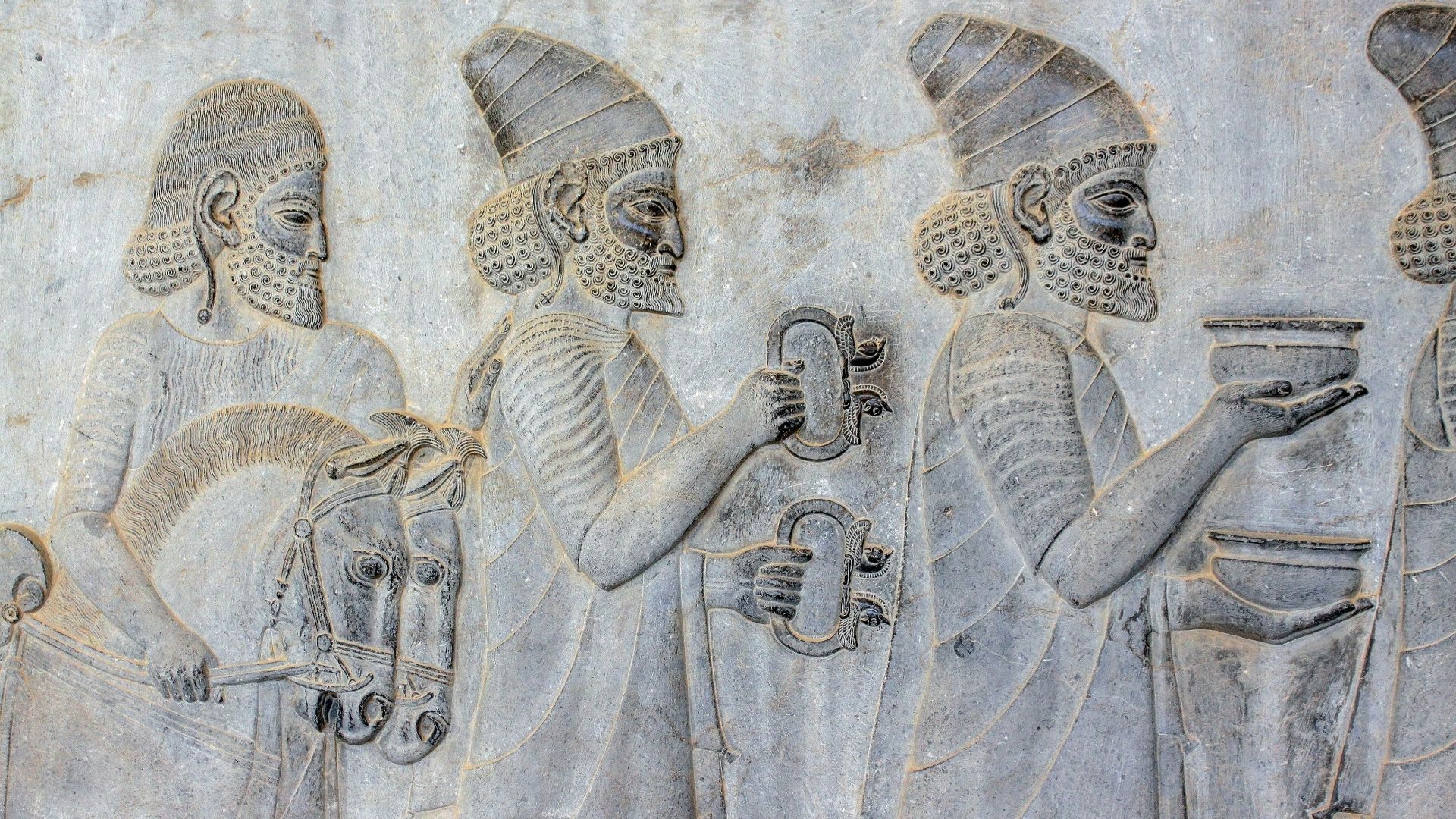 ancient embossed artwork of men