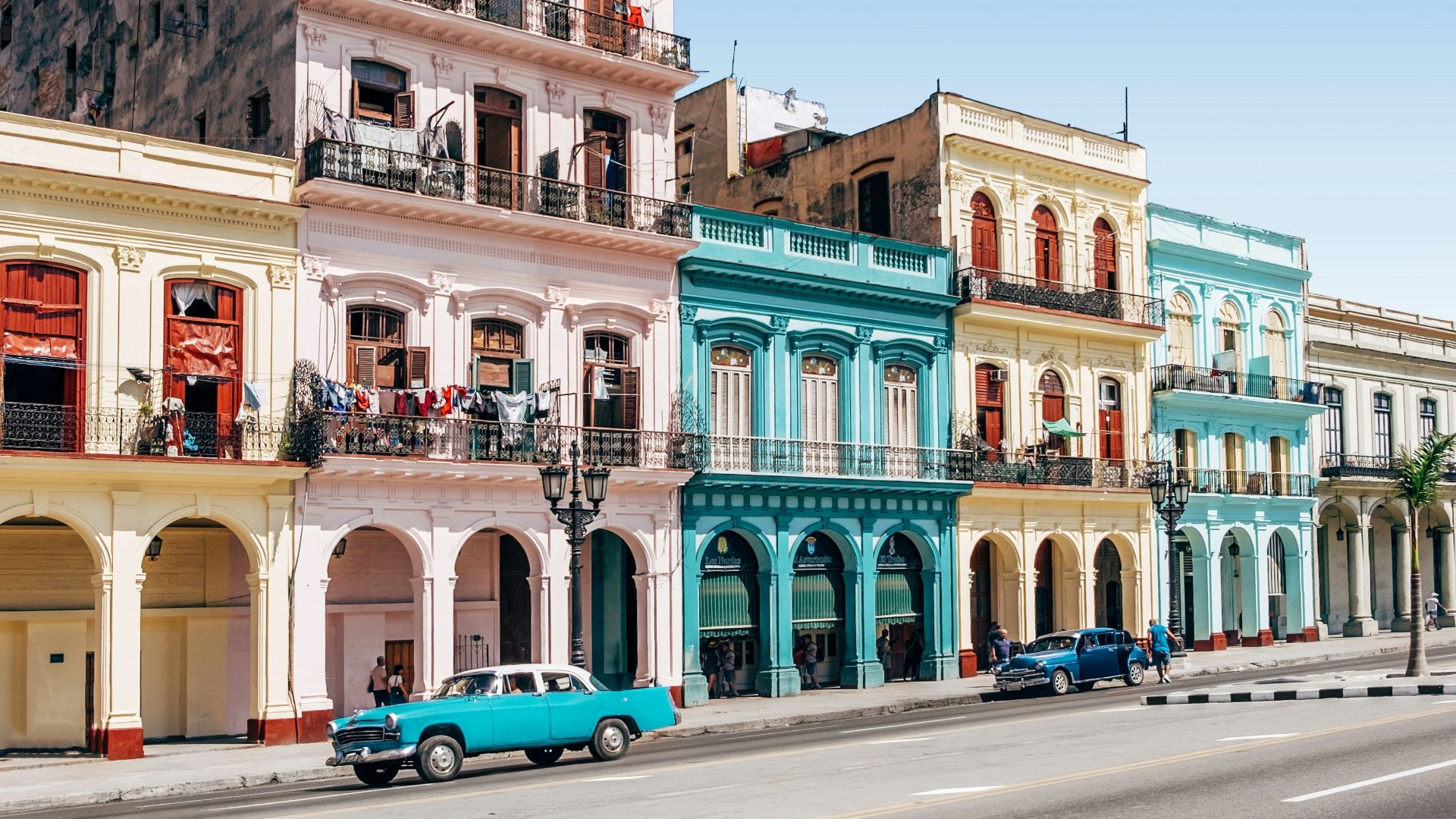 two cars parked outside building