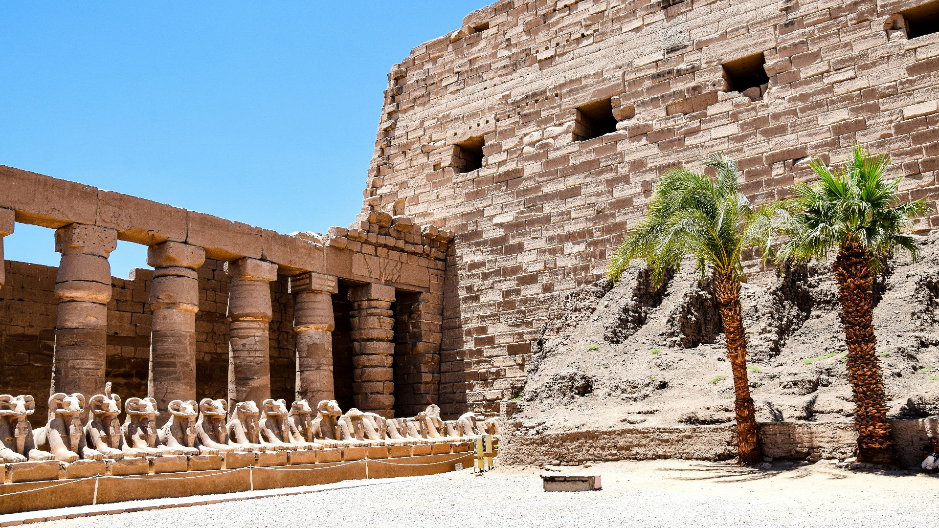 a group of statues outside of a building