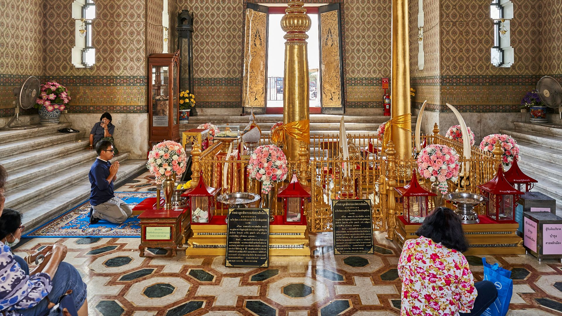 a group of people sitting on the floor in a room