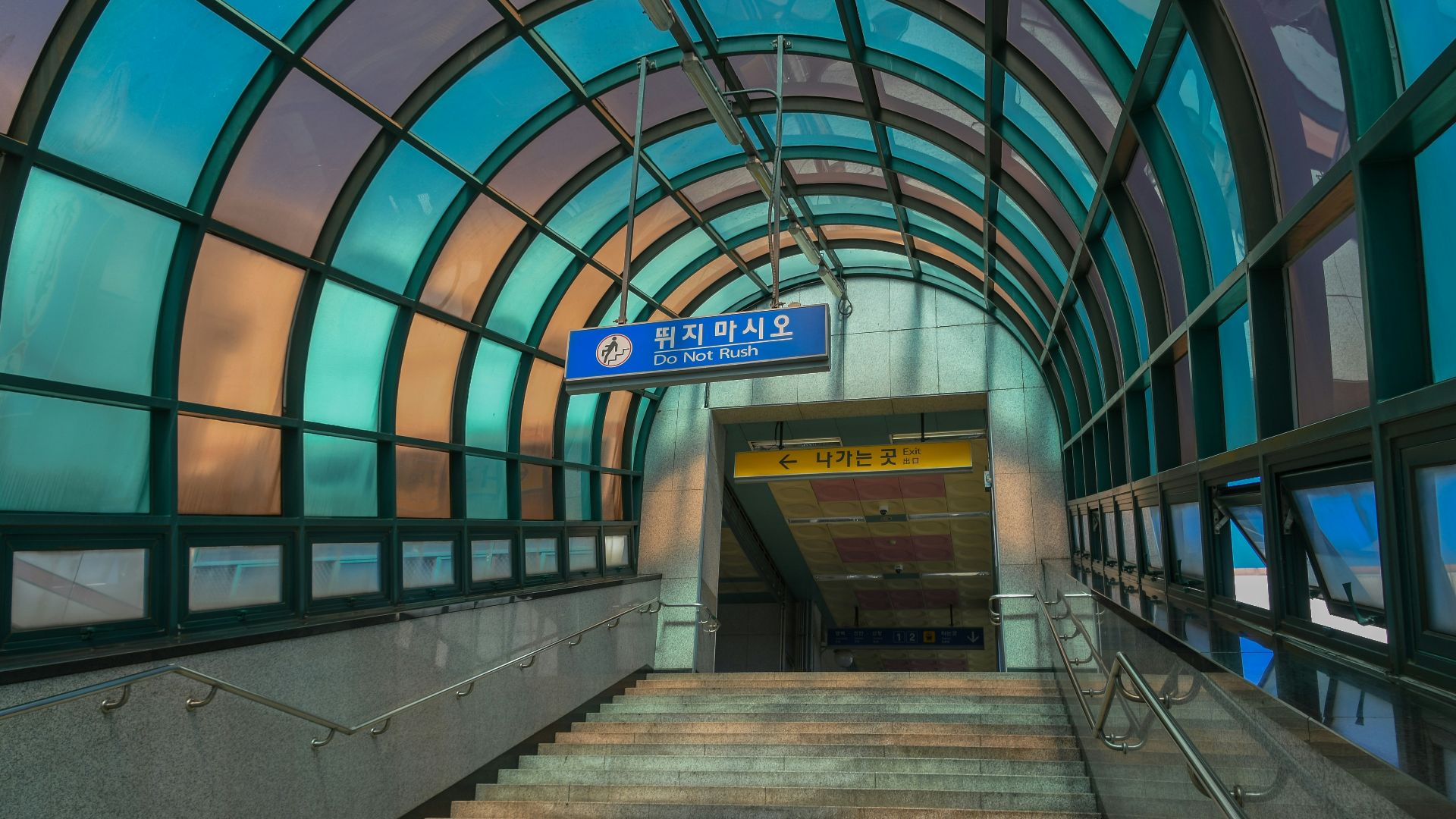 concrete stair under blue and gray dome ceiling