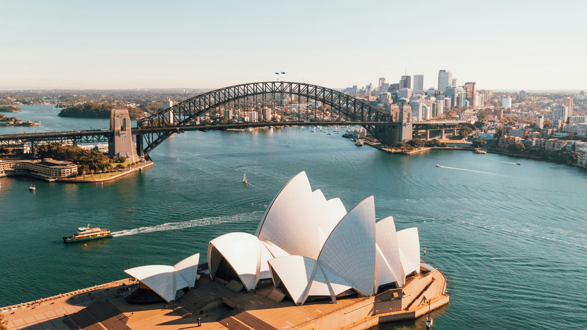sydney opera house near body of water during daytime