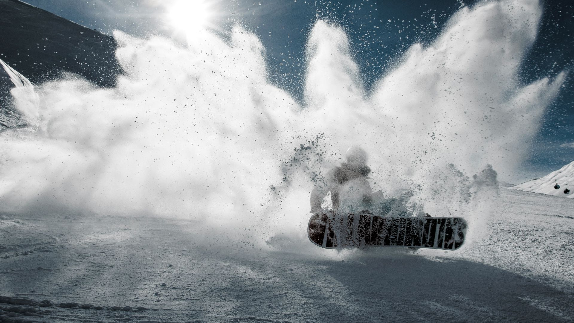 person snowboarding on mountain during daytime