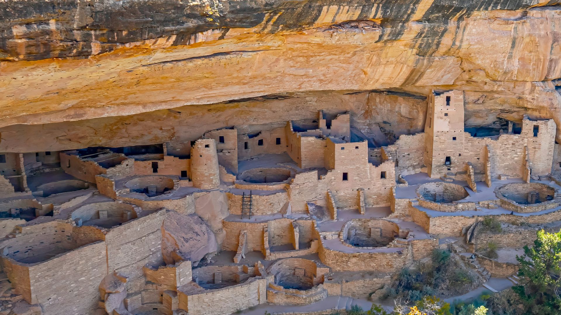 an aerial view of a cliff dwelling in a canyon