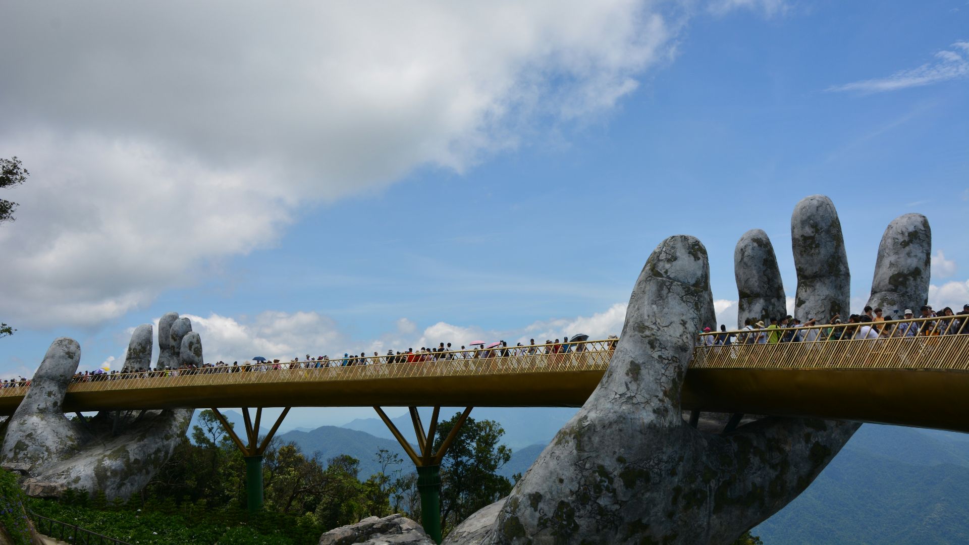 brown wooden bridge under blue sky during daytime