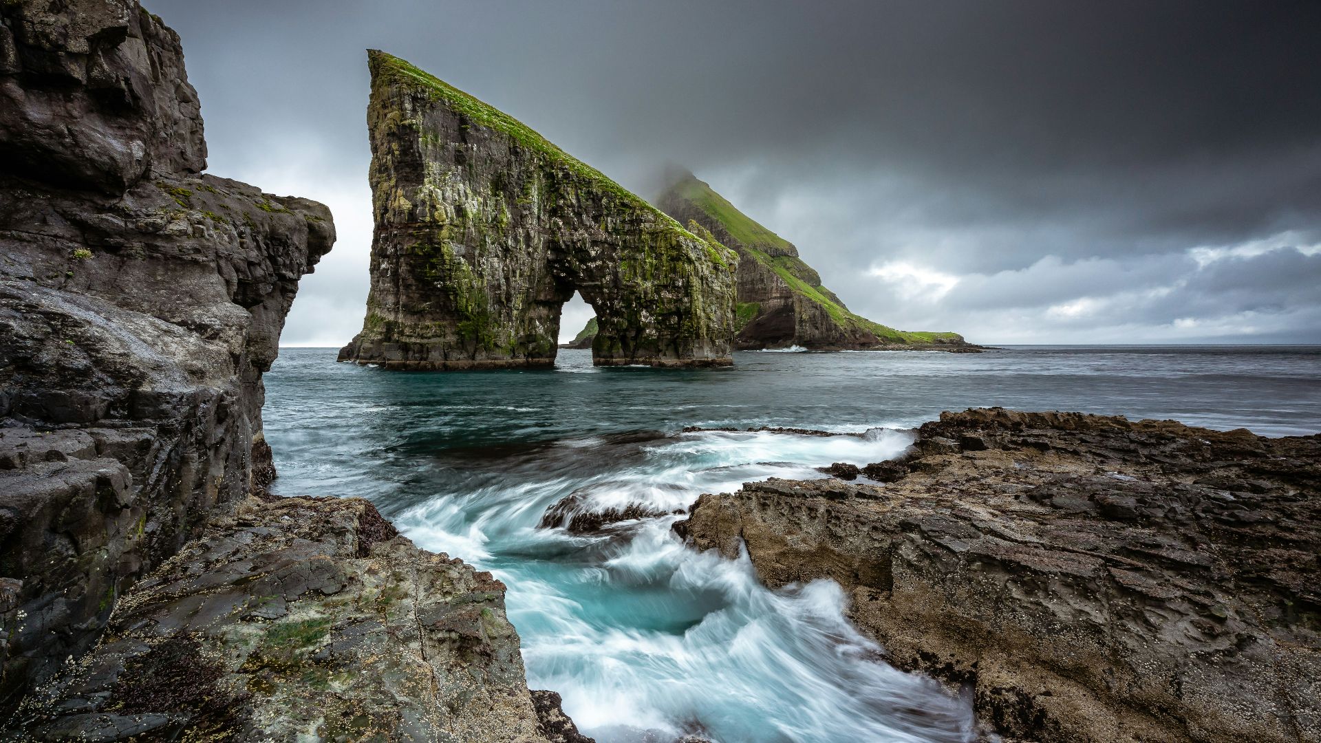 rock formation on body of water