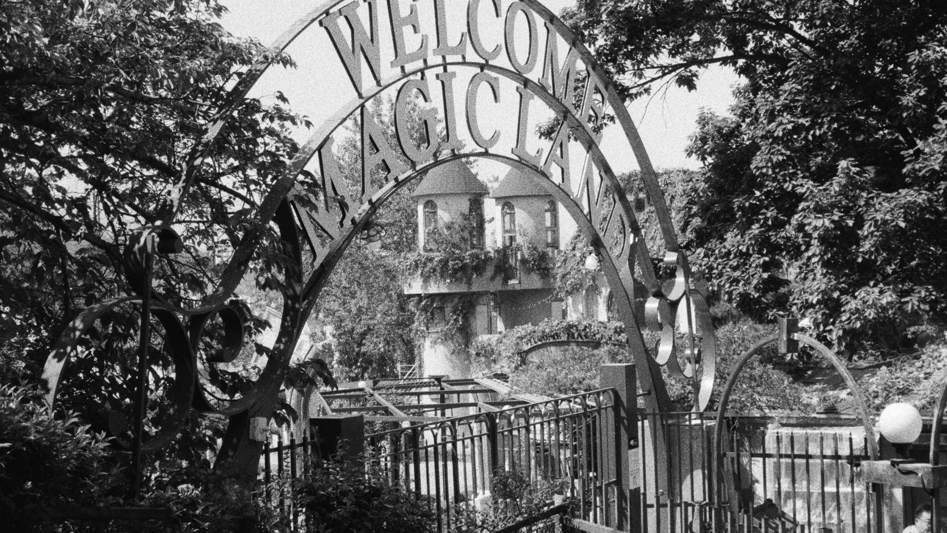 a black and white photo of a welcome sign