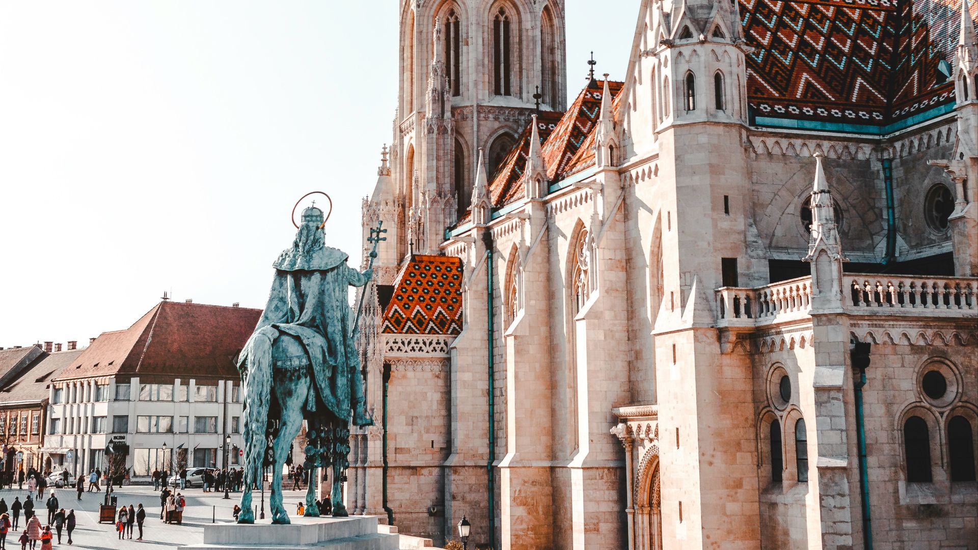 crowded people walking near statue in cathedral