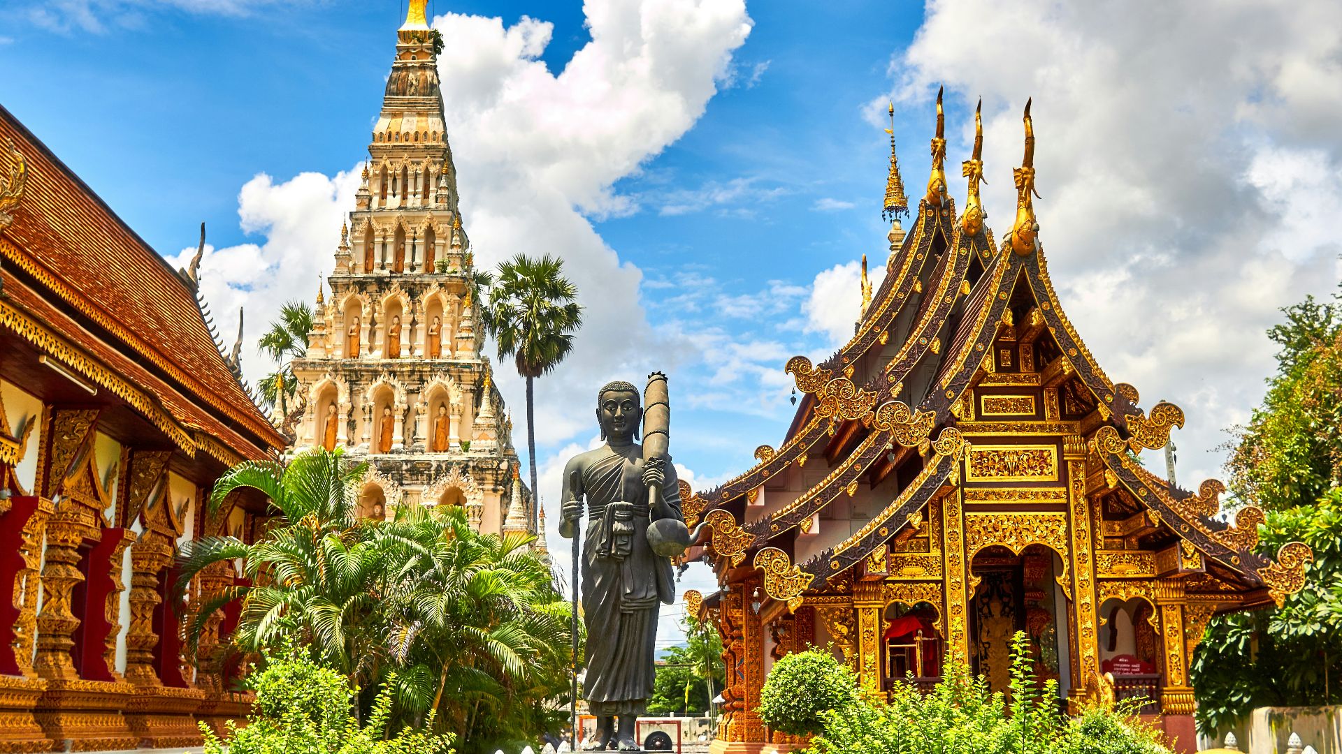 standing statue and temples landmark during daytime