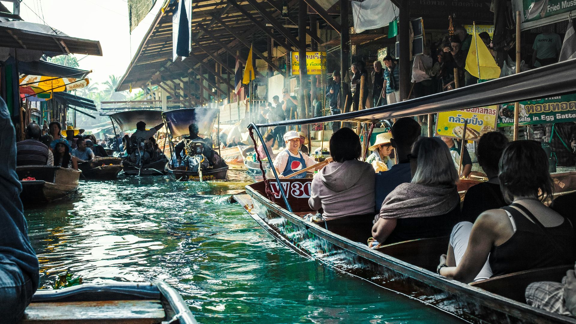 people riding on boat during daytime