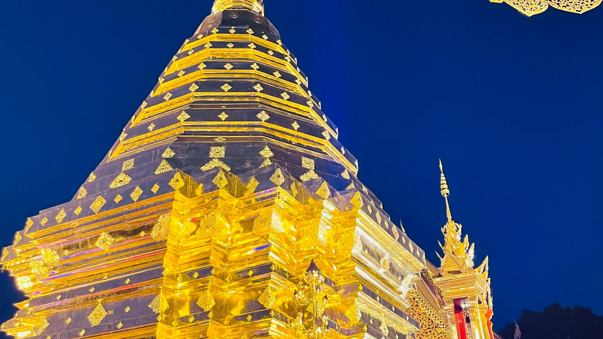 a very tall building with a big umbrella in front of it