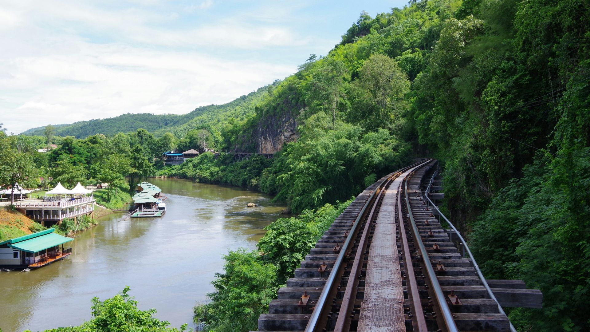 brown wooden bridge over river