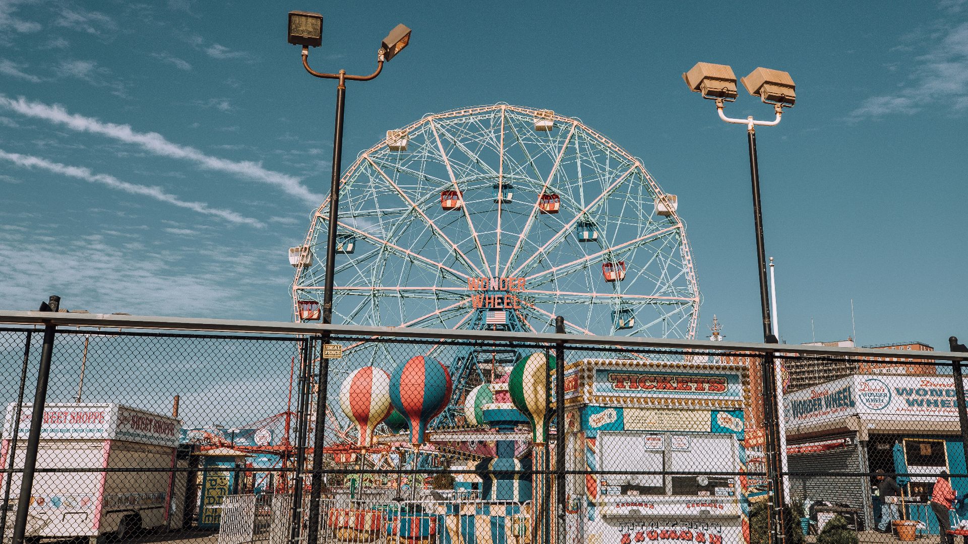 white ferris wheel under blue sky during daytime