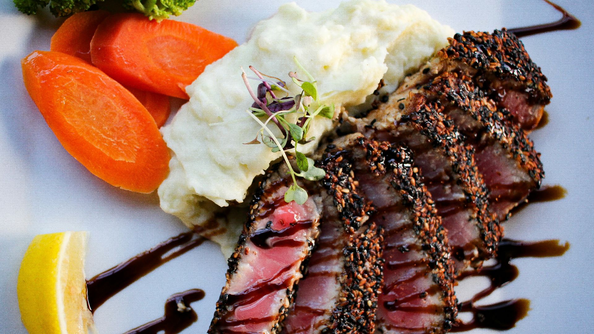 cooked food with sliced carrots and green vegetable