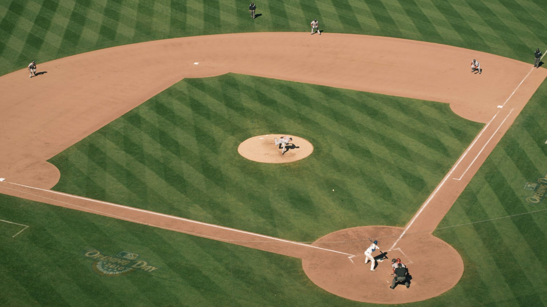 people playing baseball on field during daytime