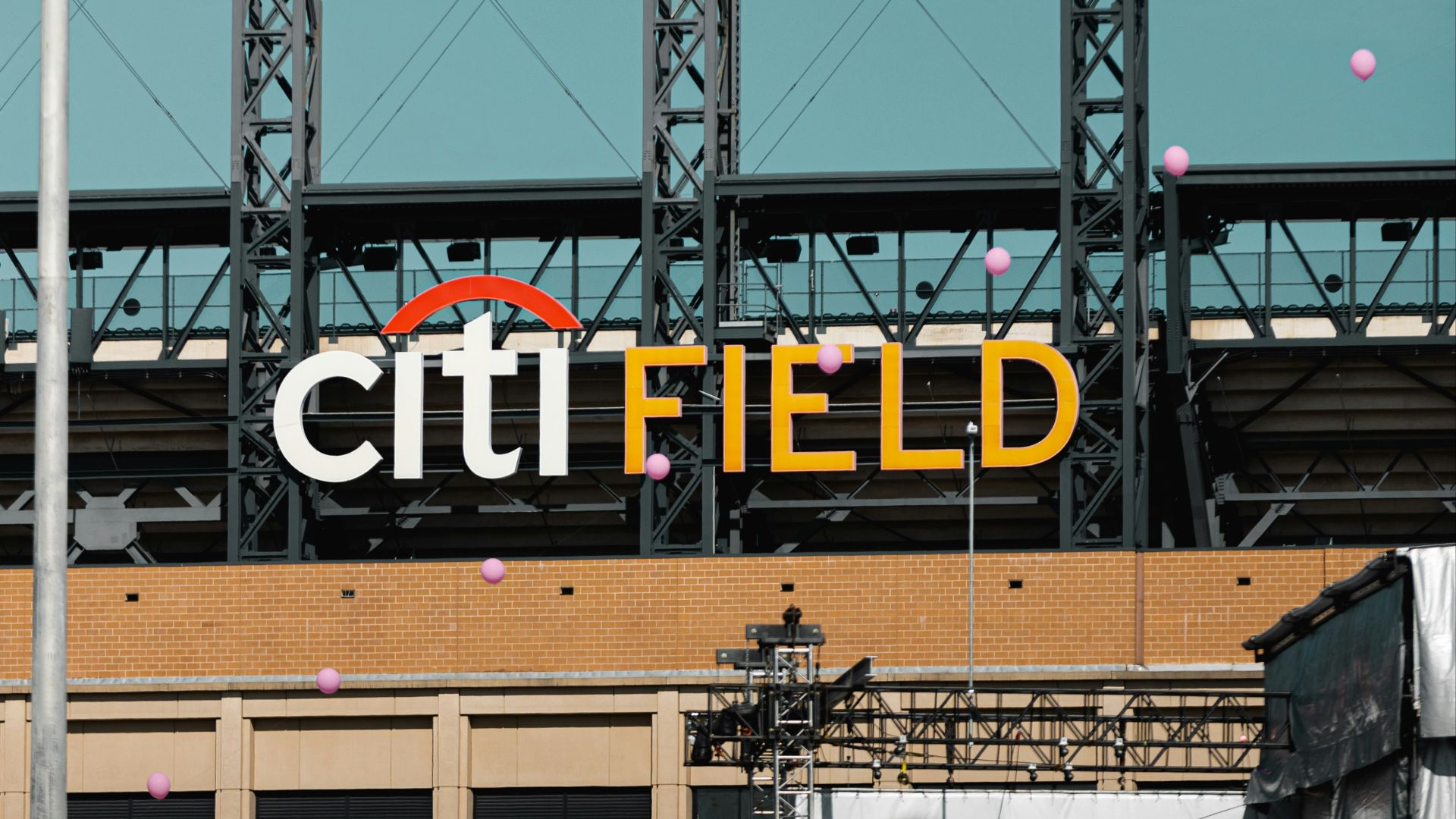 a crowd of people walking around a field