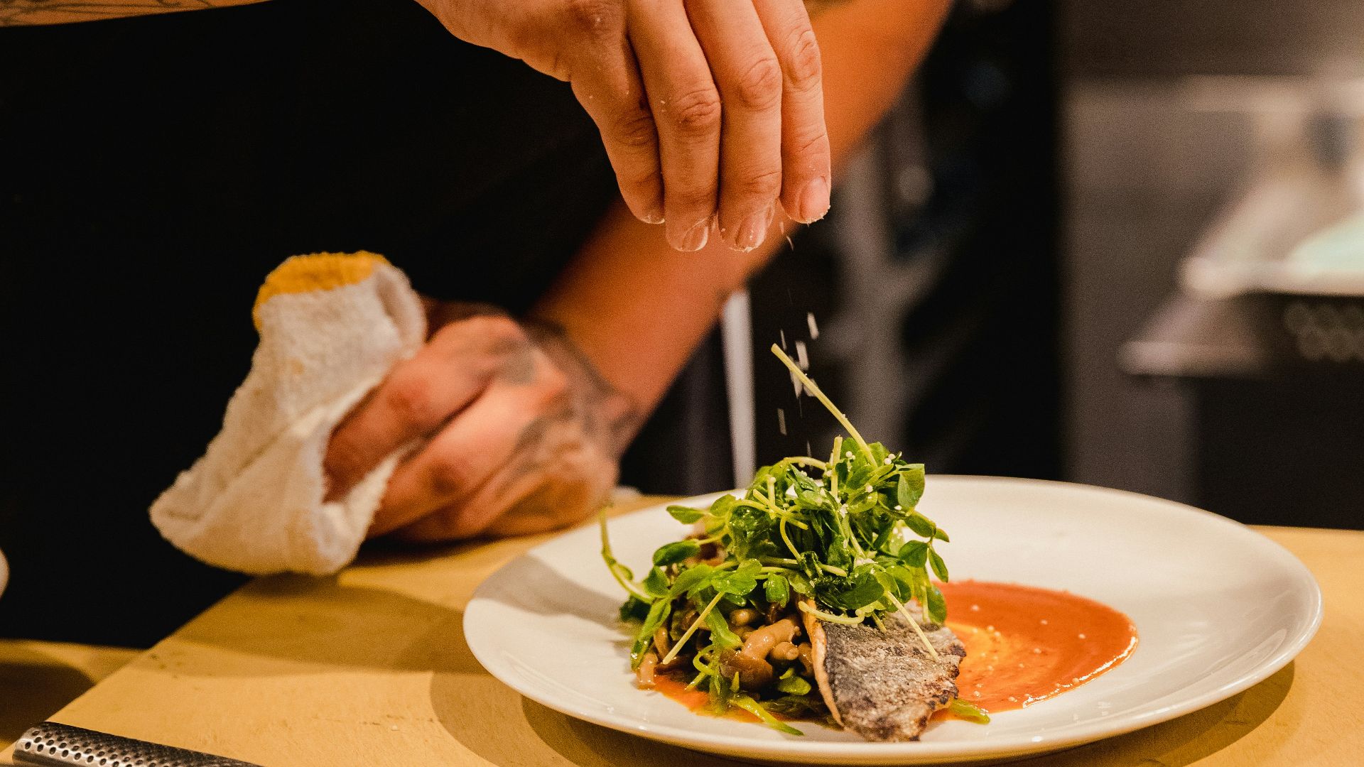 man standing front of plate with vegetable
