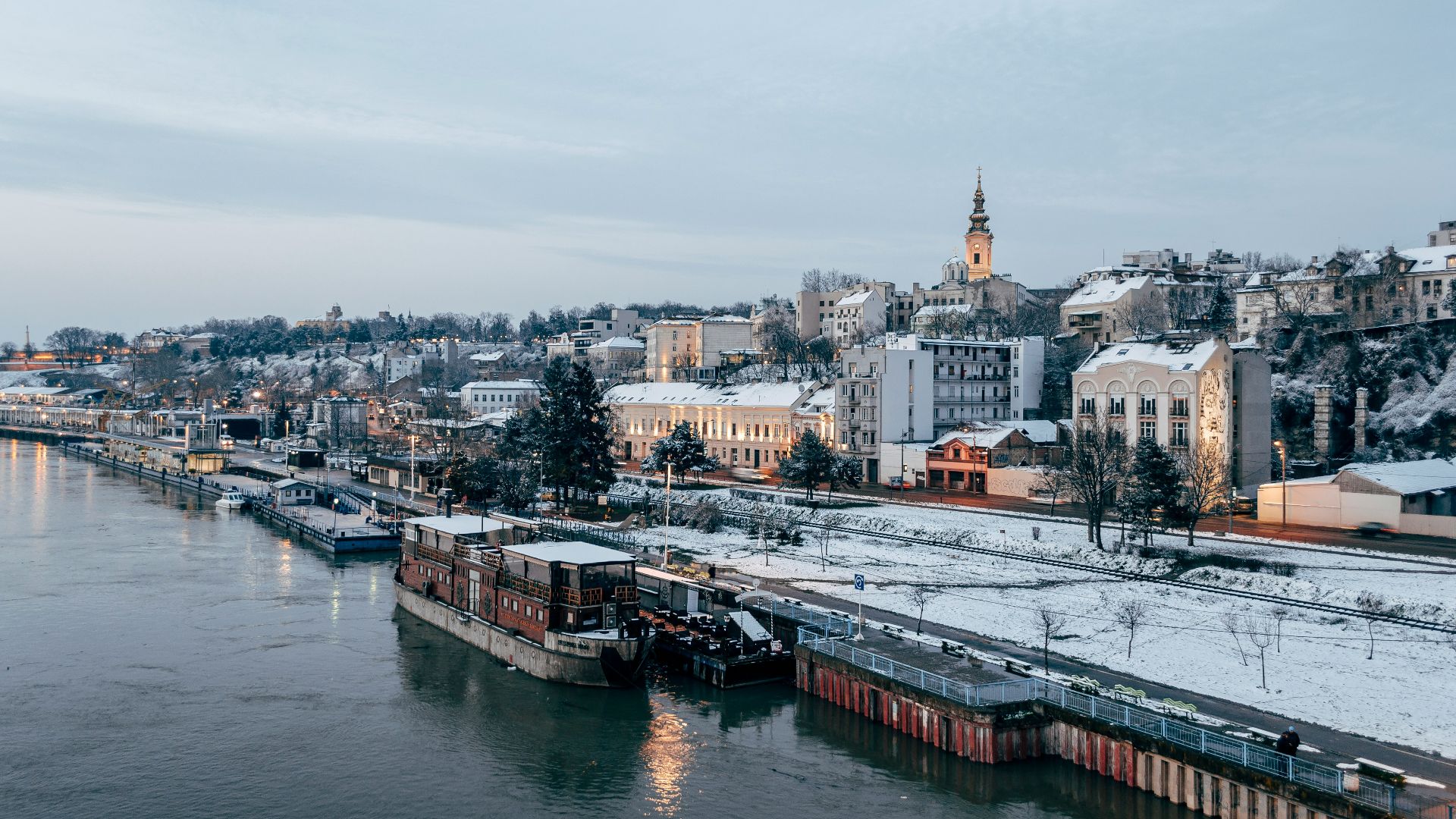 city buildings near body of water during daytime