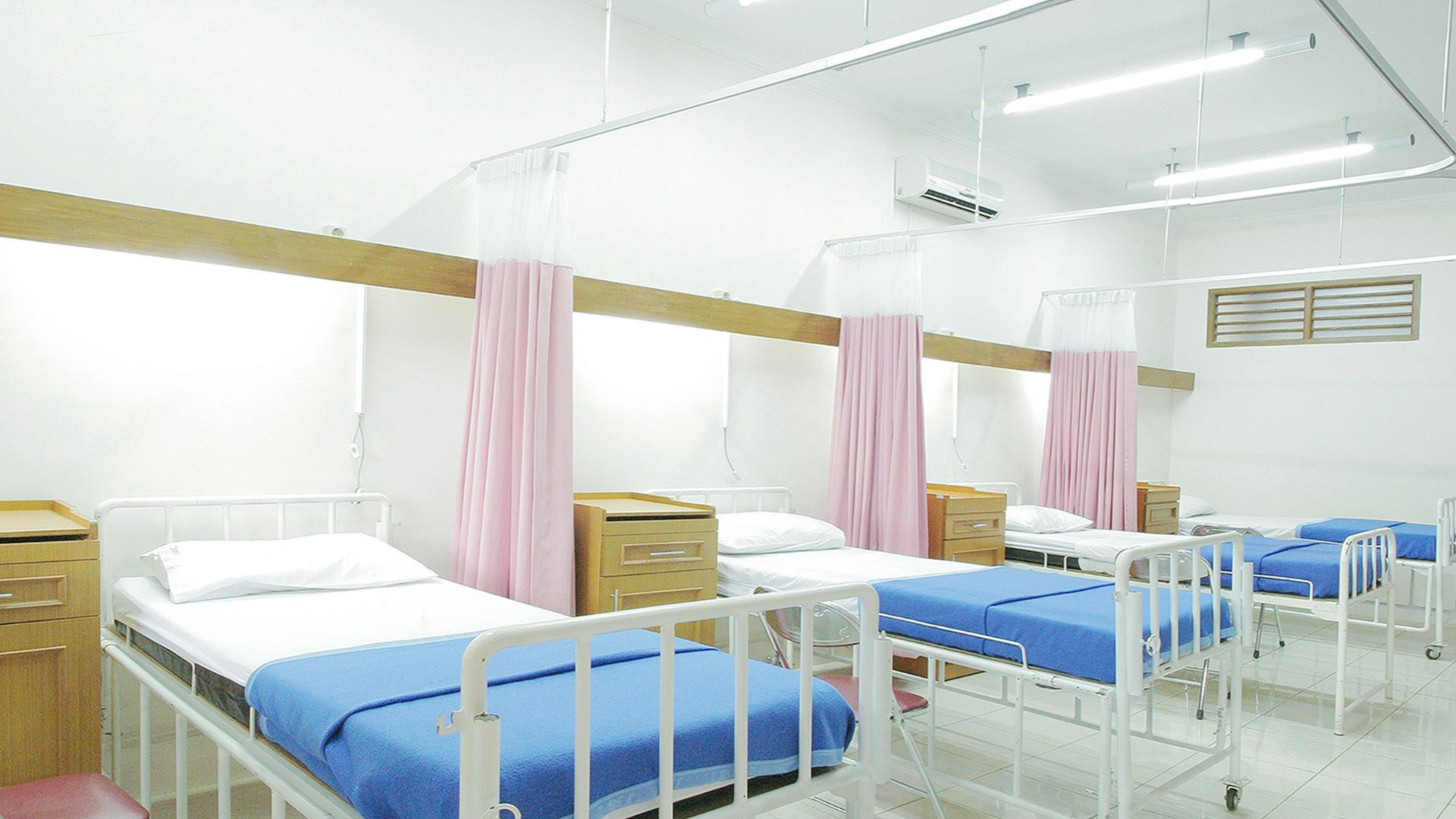 empty hospital bed inside room