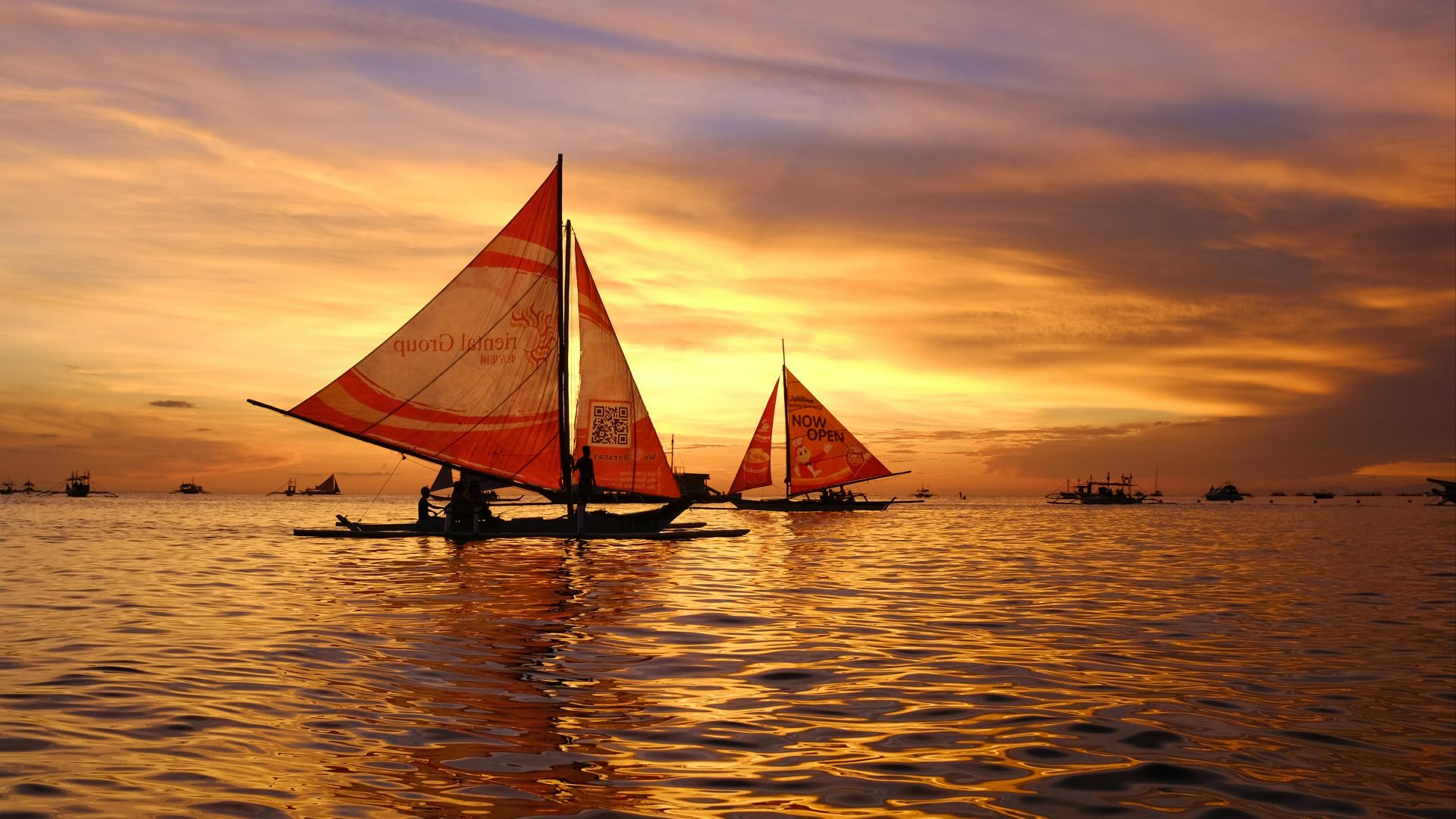 silhouette of sail boats floating on body of water