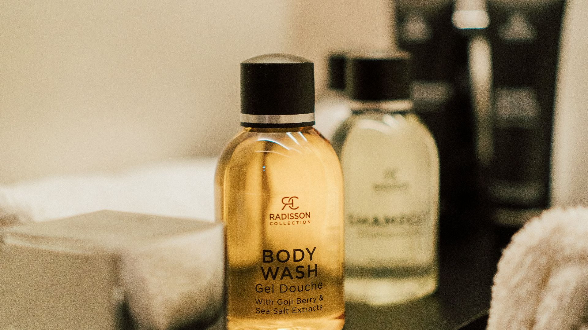 a close up of a bottle of soap on a table