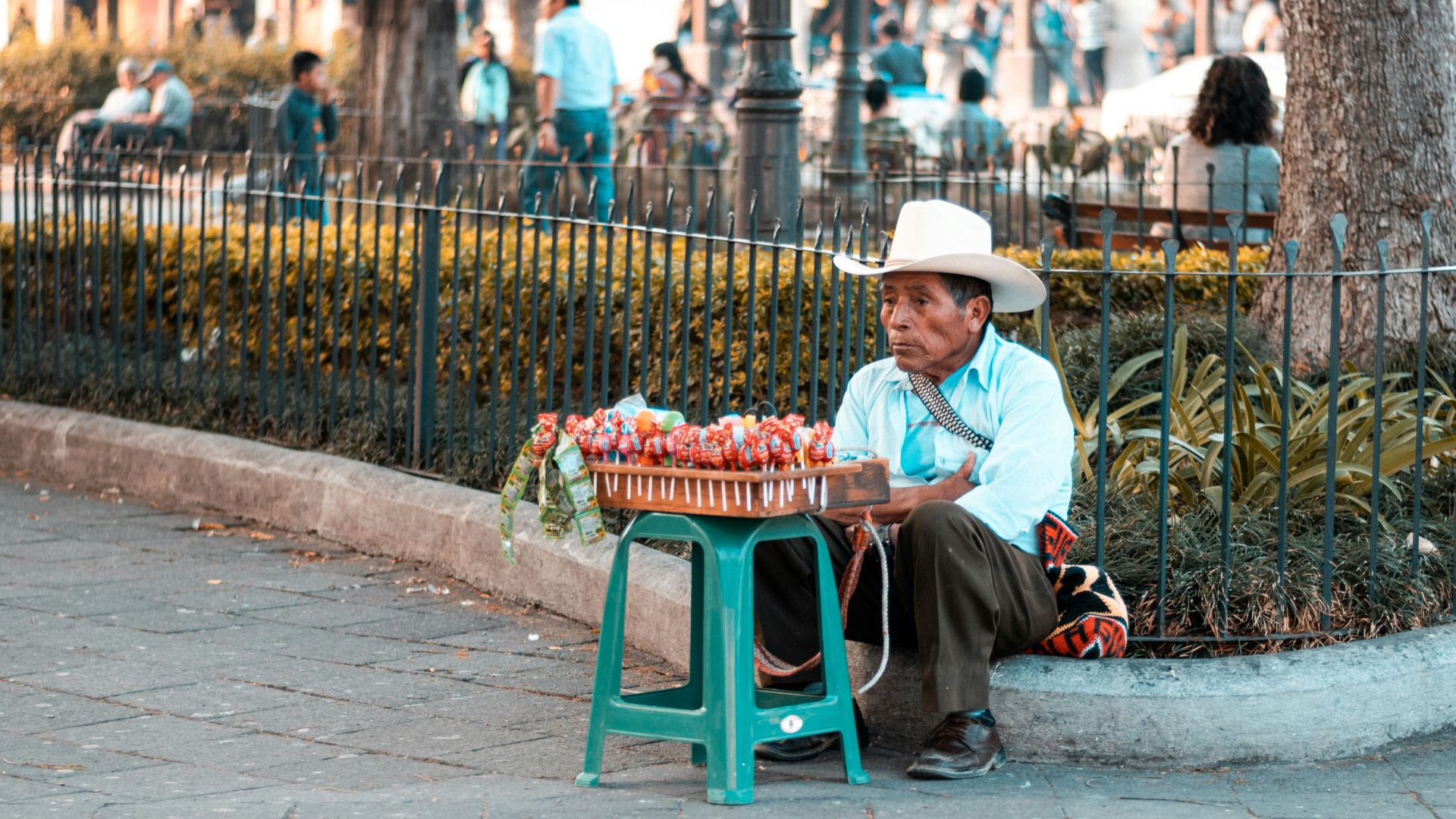 boy in red shirt sitting on green chair