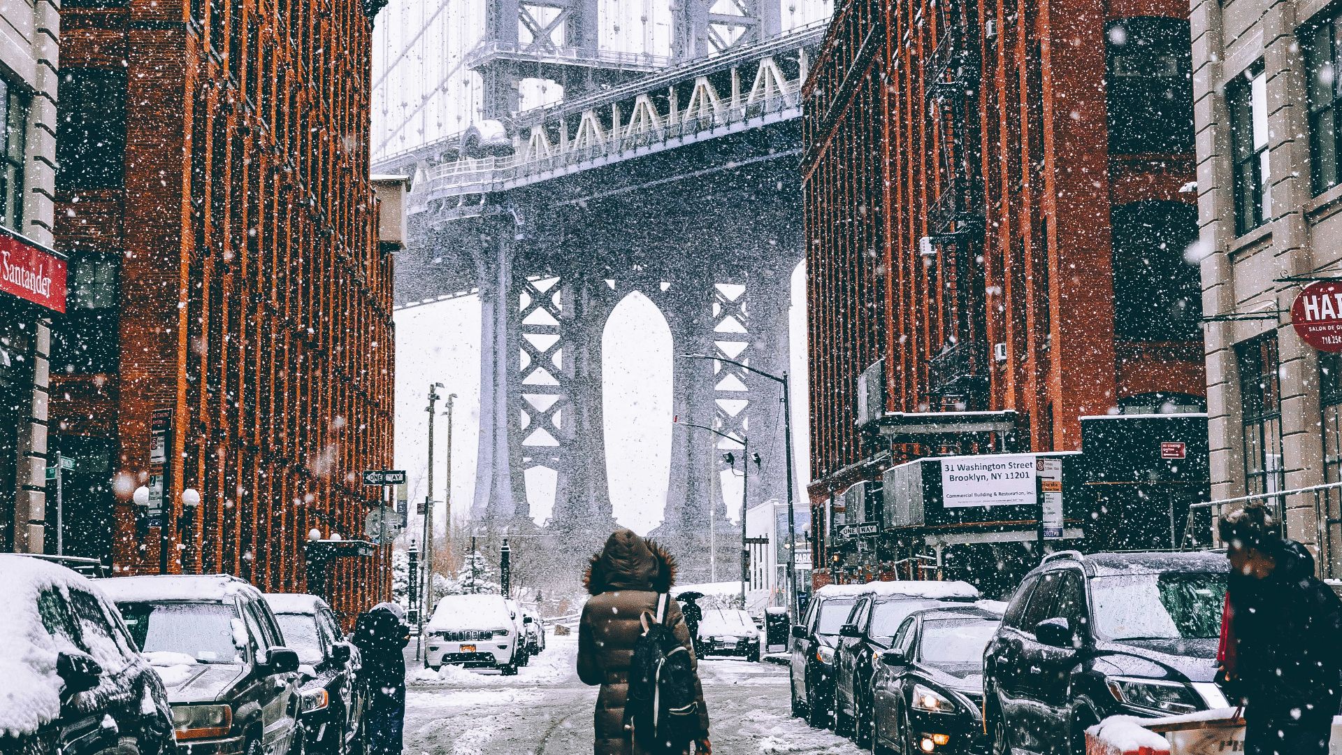 woman facing towards Brooklyn Bridge in New York