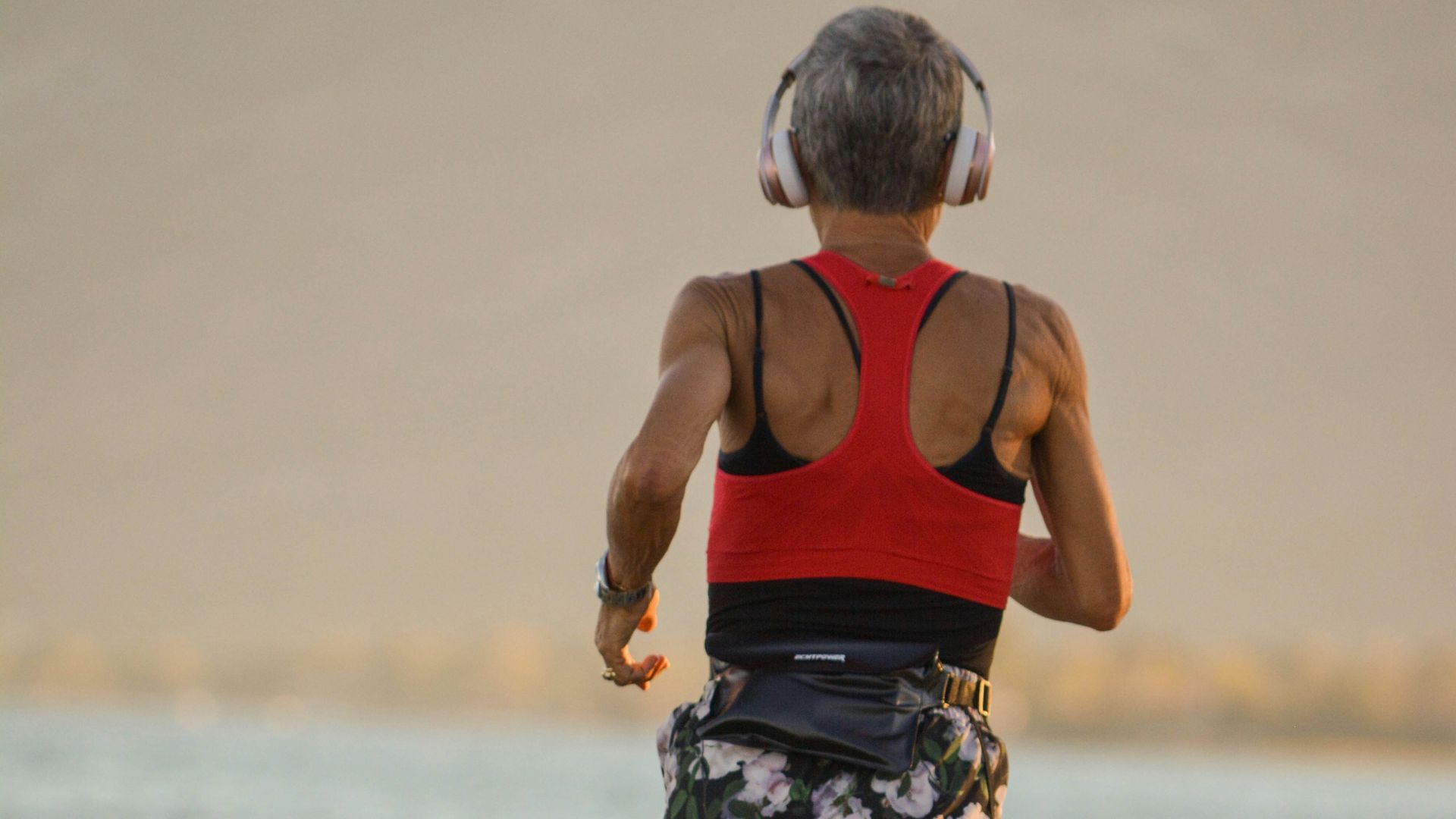 a boy walking on a beach