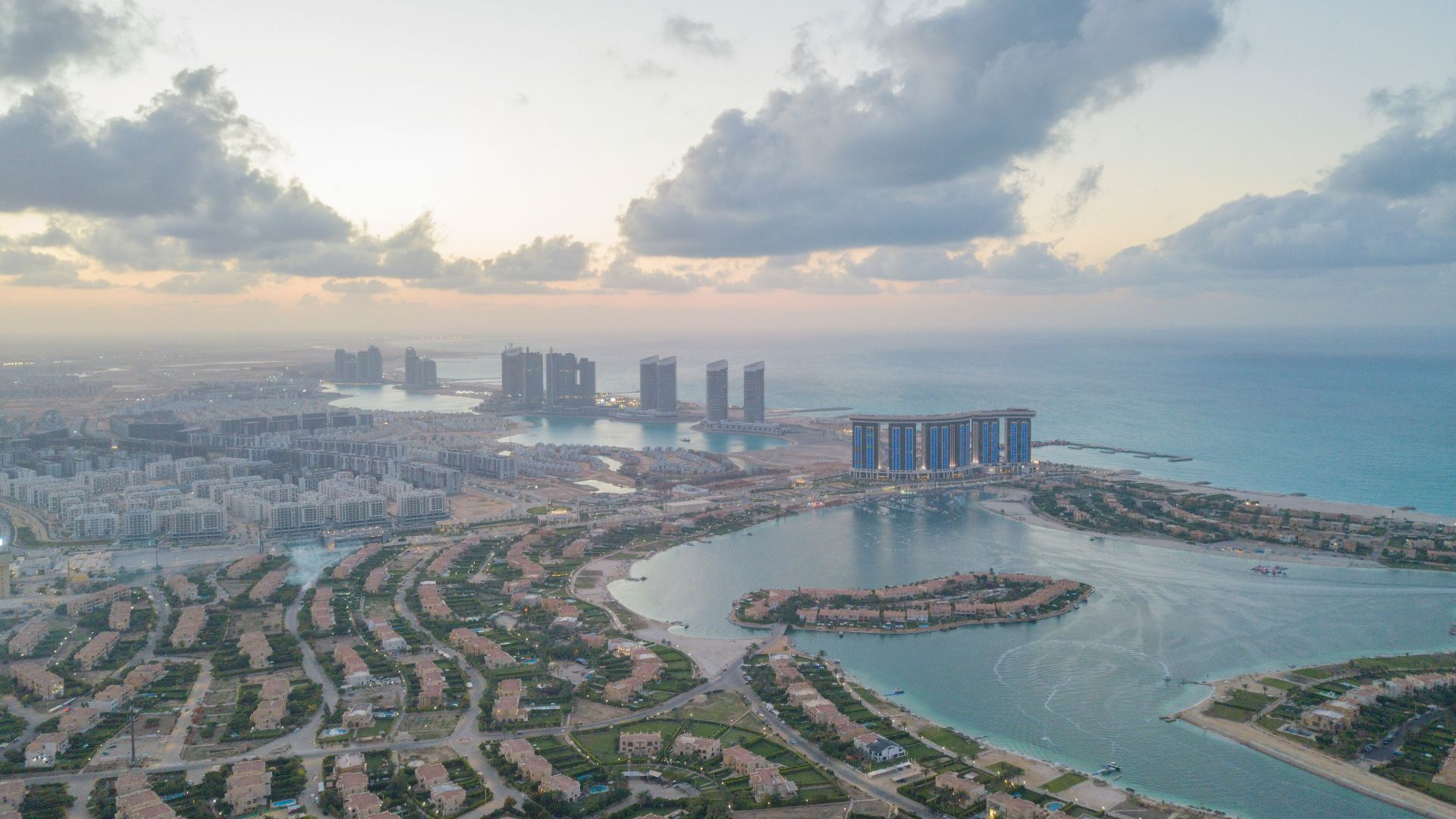 An aerial view of a city and a body of water