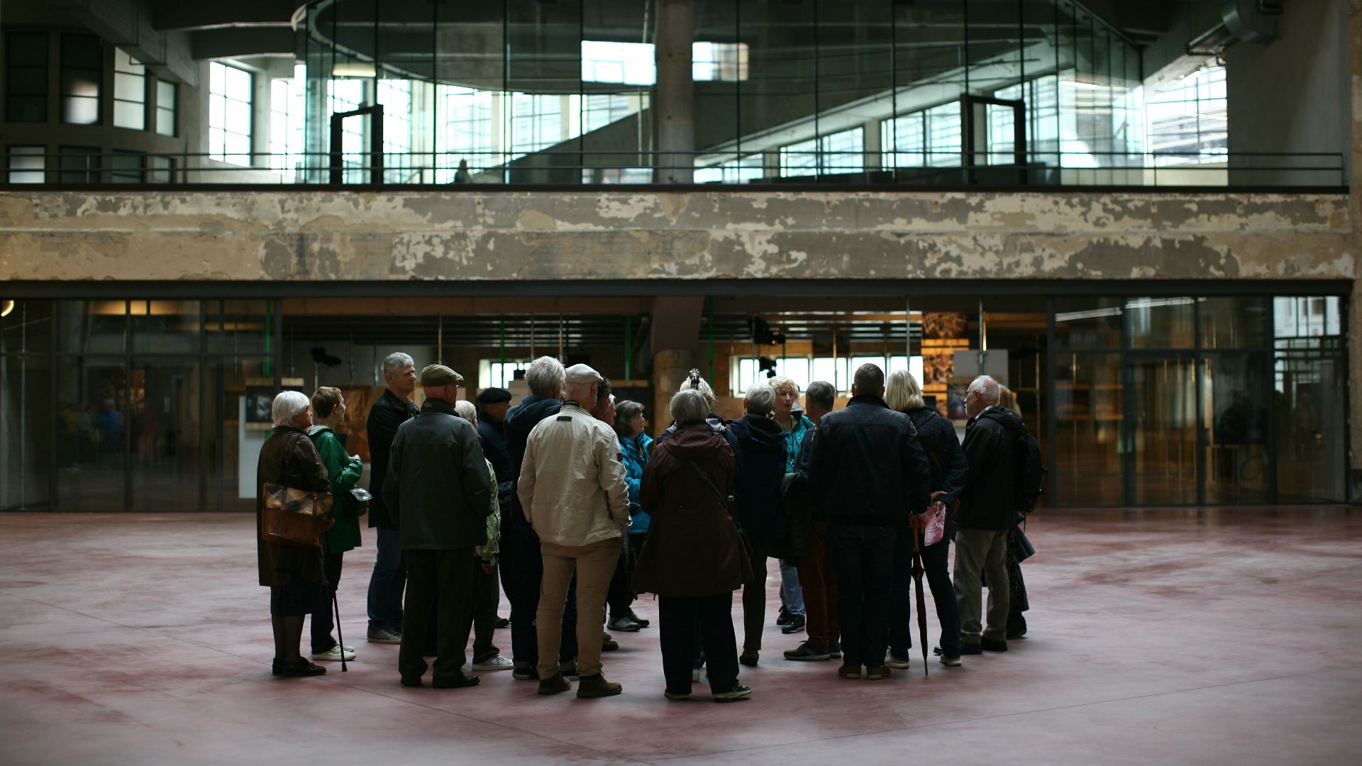 a group of people standing in front of a building