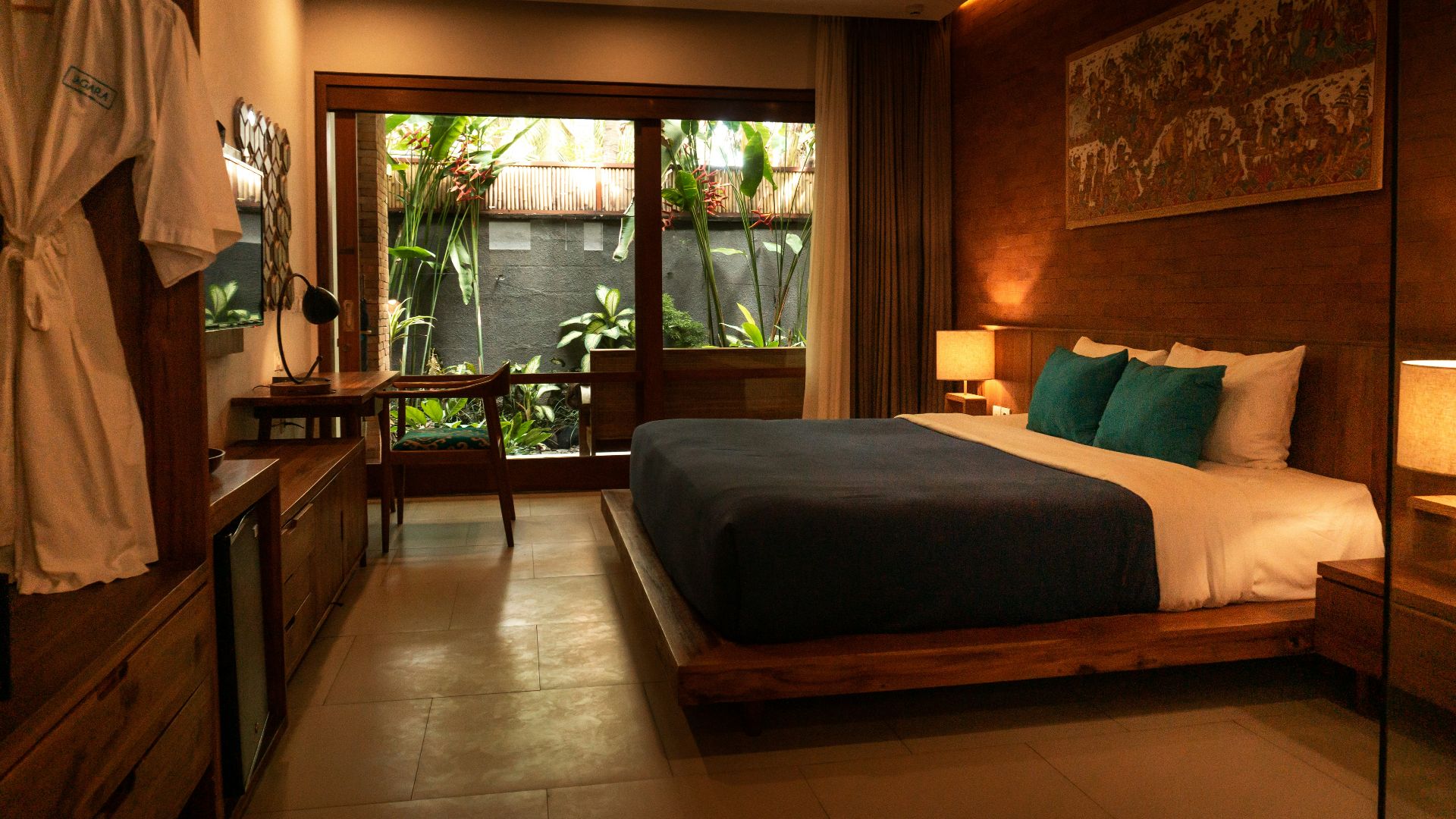 black and white bed near brown wooden table