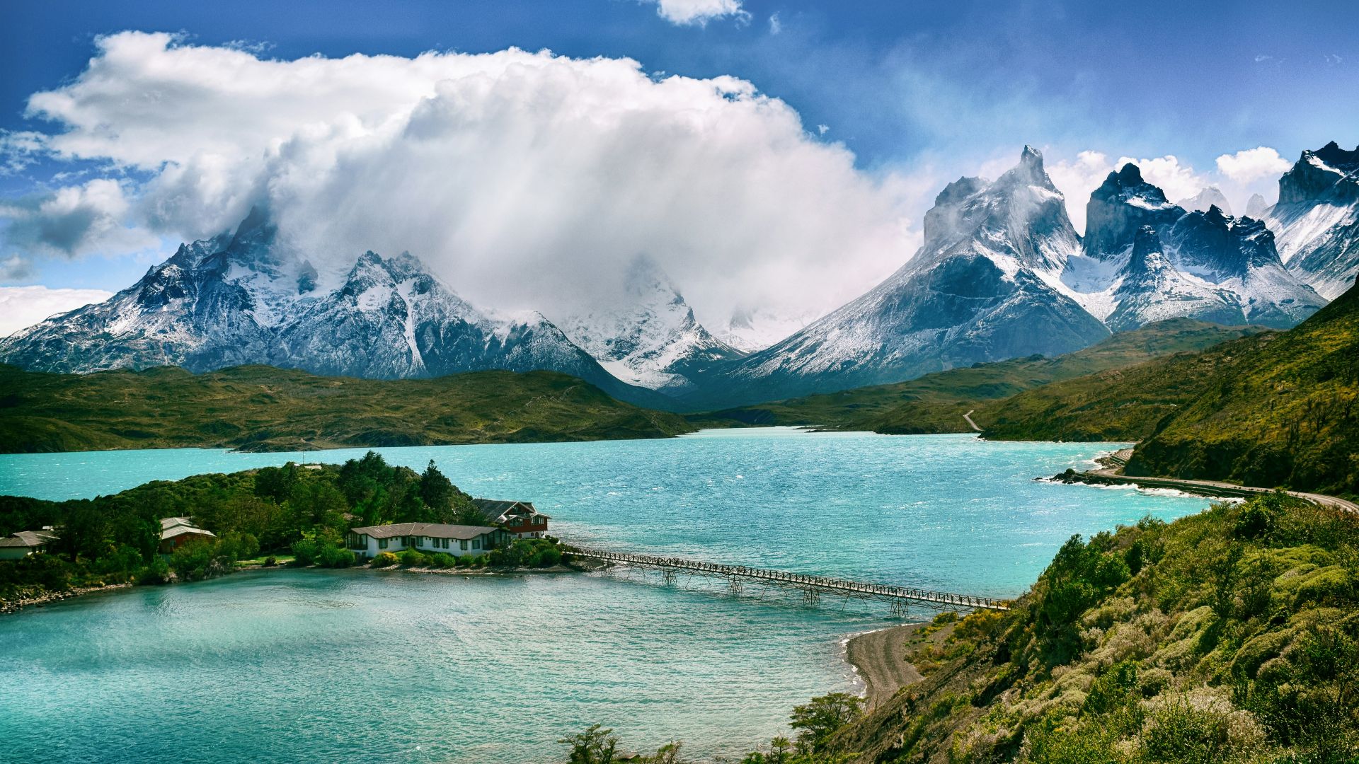 lake near snow-covered mountain during daytime