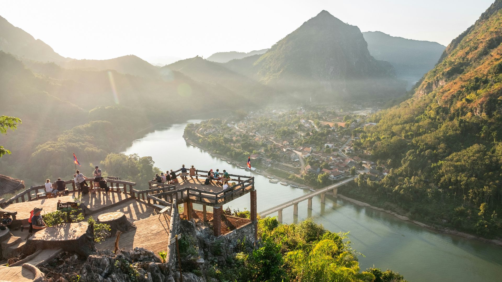 a group of people standing on top of a mountain