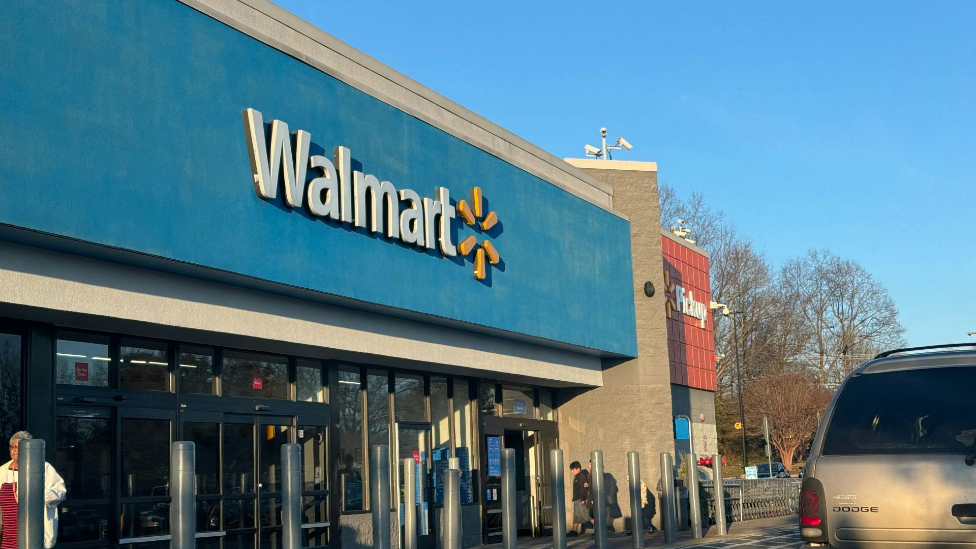 a walmart store with a car parked in front of it