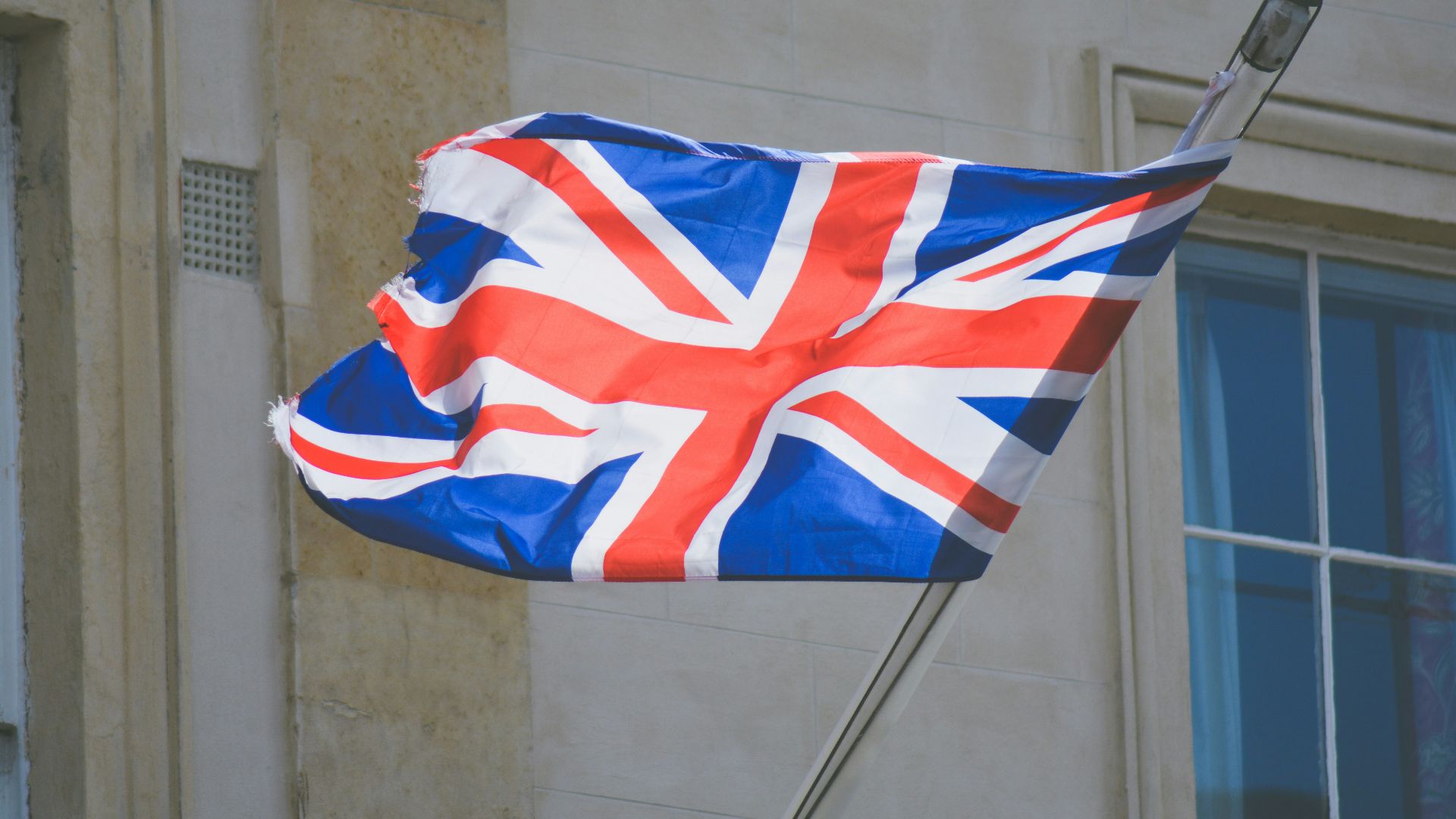 raised United Kingdom flag