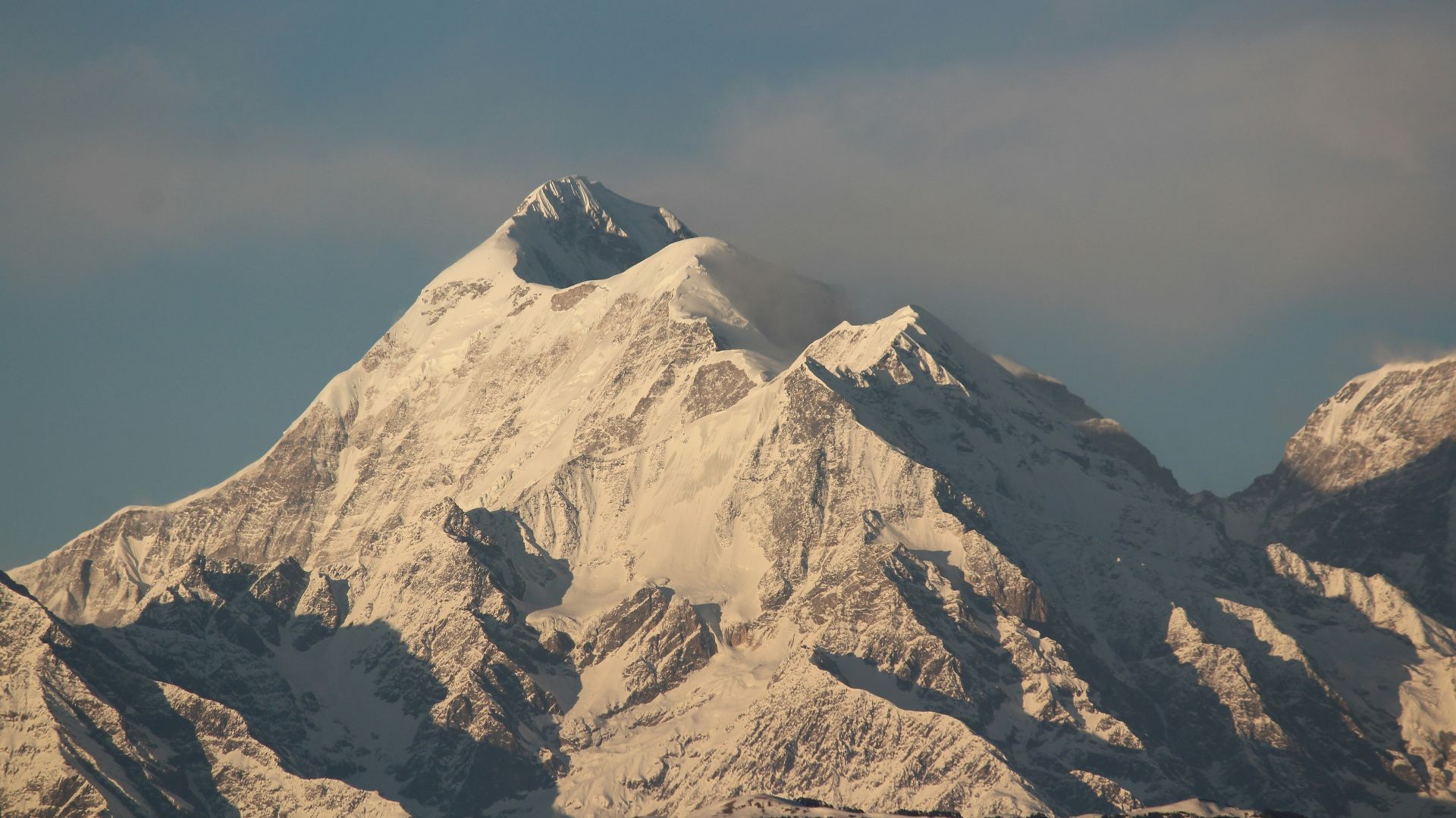 snow covered mountain under blue sky during daytime