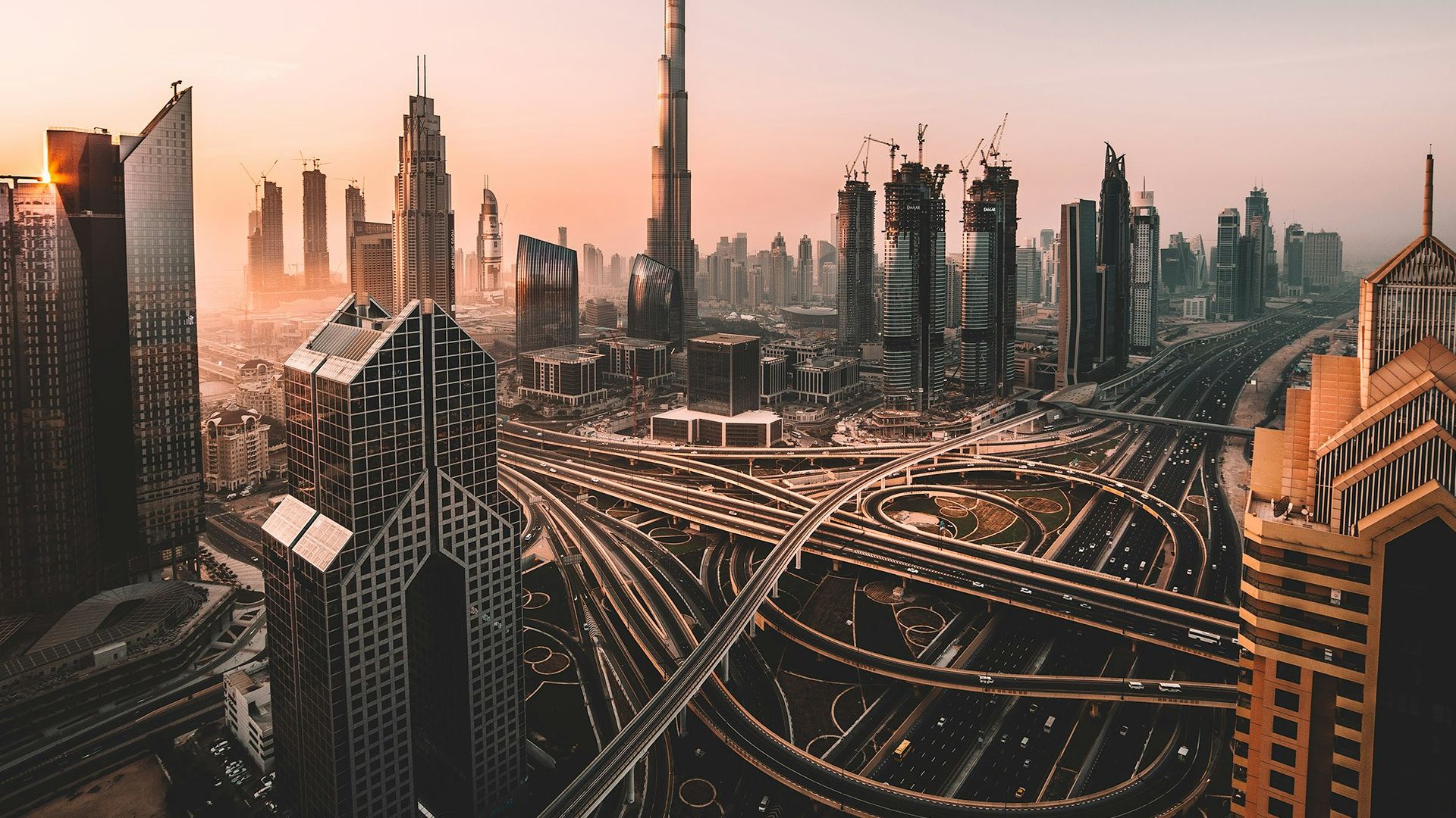 aerial photo of city highway surrounded by high-rise buildings