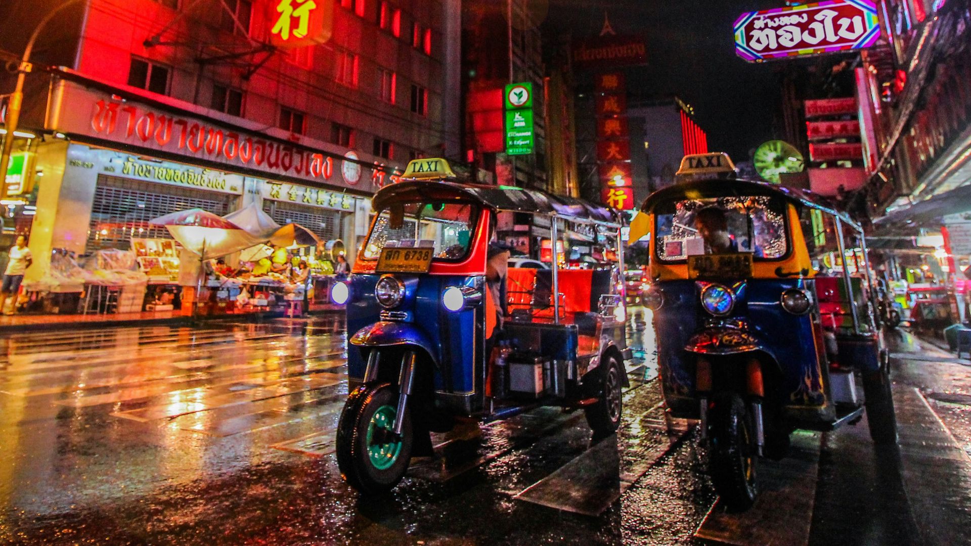 two auto rickshaw on the street