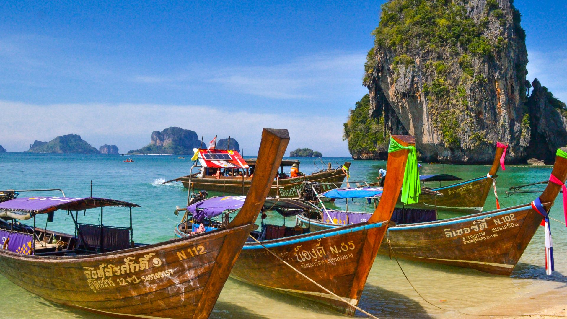 five brown wooden boats